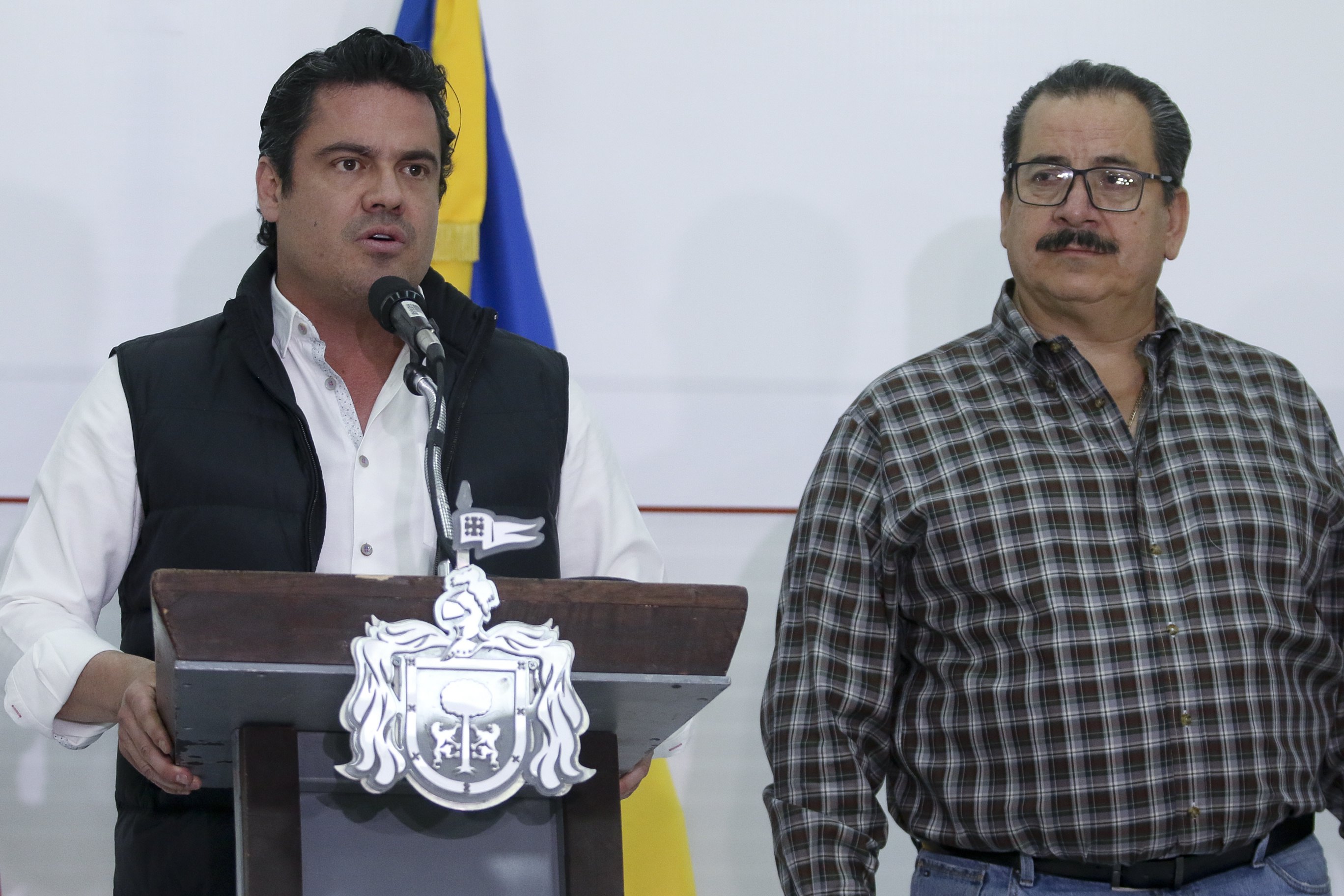 Jalisco Gov. Aristoteles Sandoval (L) and Jalisco Attorney General Raul Sanchez at a press conference in Guadalajara, Jalisco, Mexico, March 25, 2018. EPA-EFE/CARLOS ZEPEDA