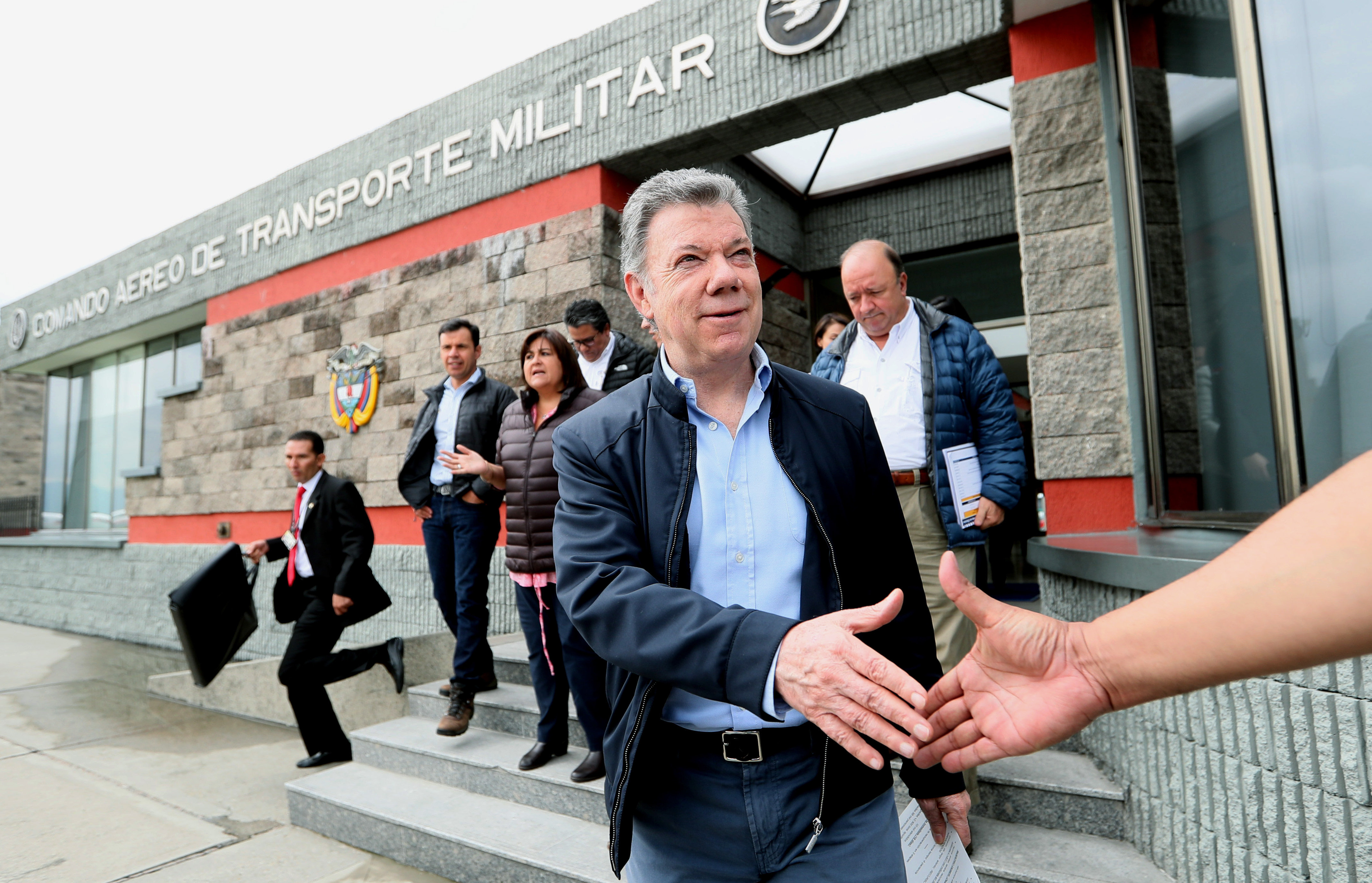 Colombian President Juan Manuel Santos (r.) is seen at the Military Air Transport Command (Catam) in Bogota on April 2, 2018, after his trip to Mocoa was canceled - he had intended to visit that city, devastated a year ago by an earthquake, to deliver 28 new houses to local families left homeless at the time. EFE-EPA/Mauricio Duenas Castaneda