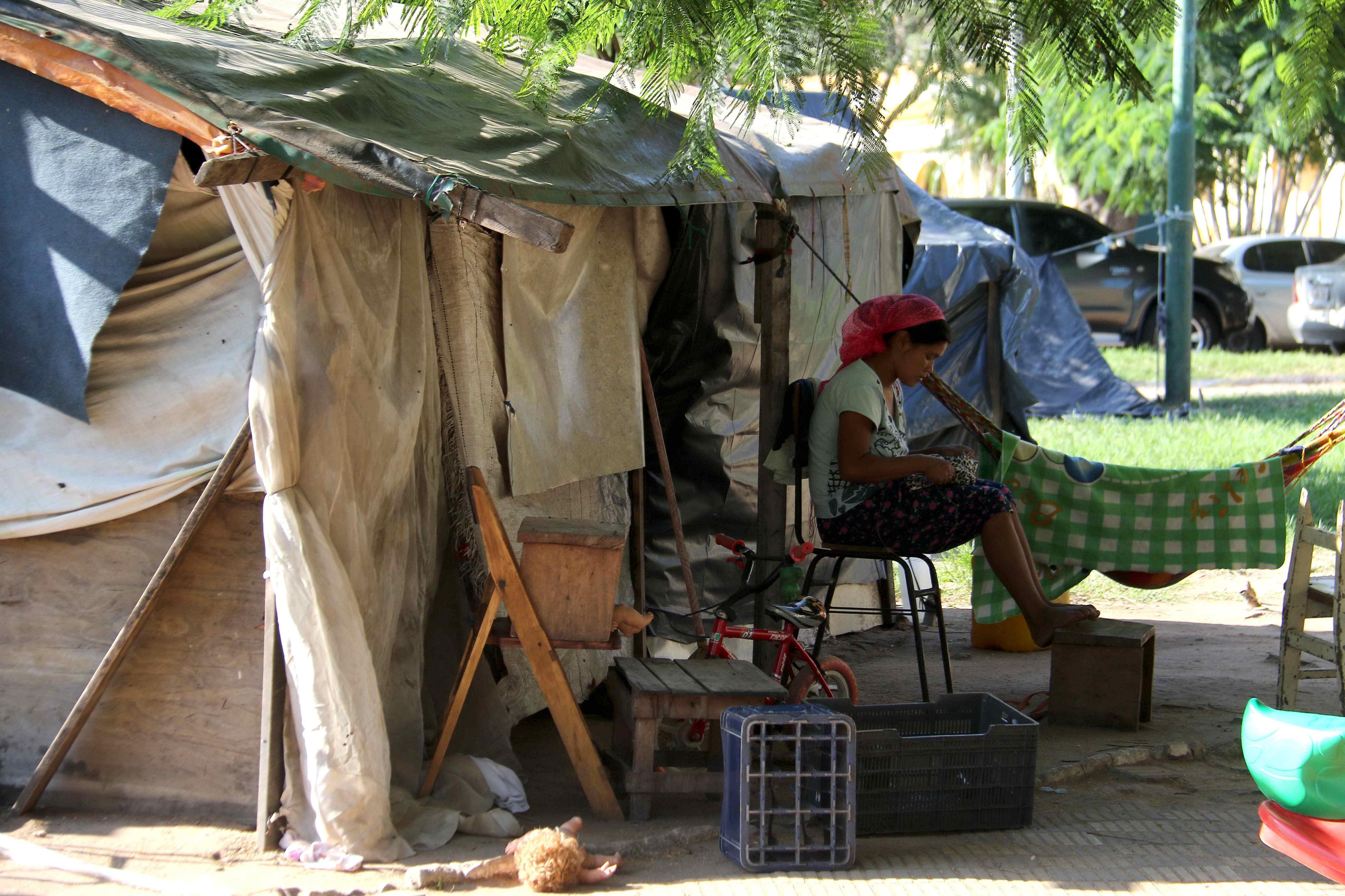 Hundreds of protesters from all over the country seeking a solution to their housing and land ownership issues camp out in the main square of Asuncion, Paraguay, Apr. 10, 2018. EPA-EFE/Andres Cristaldo