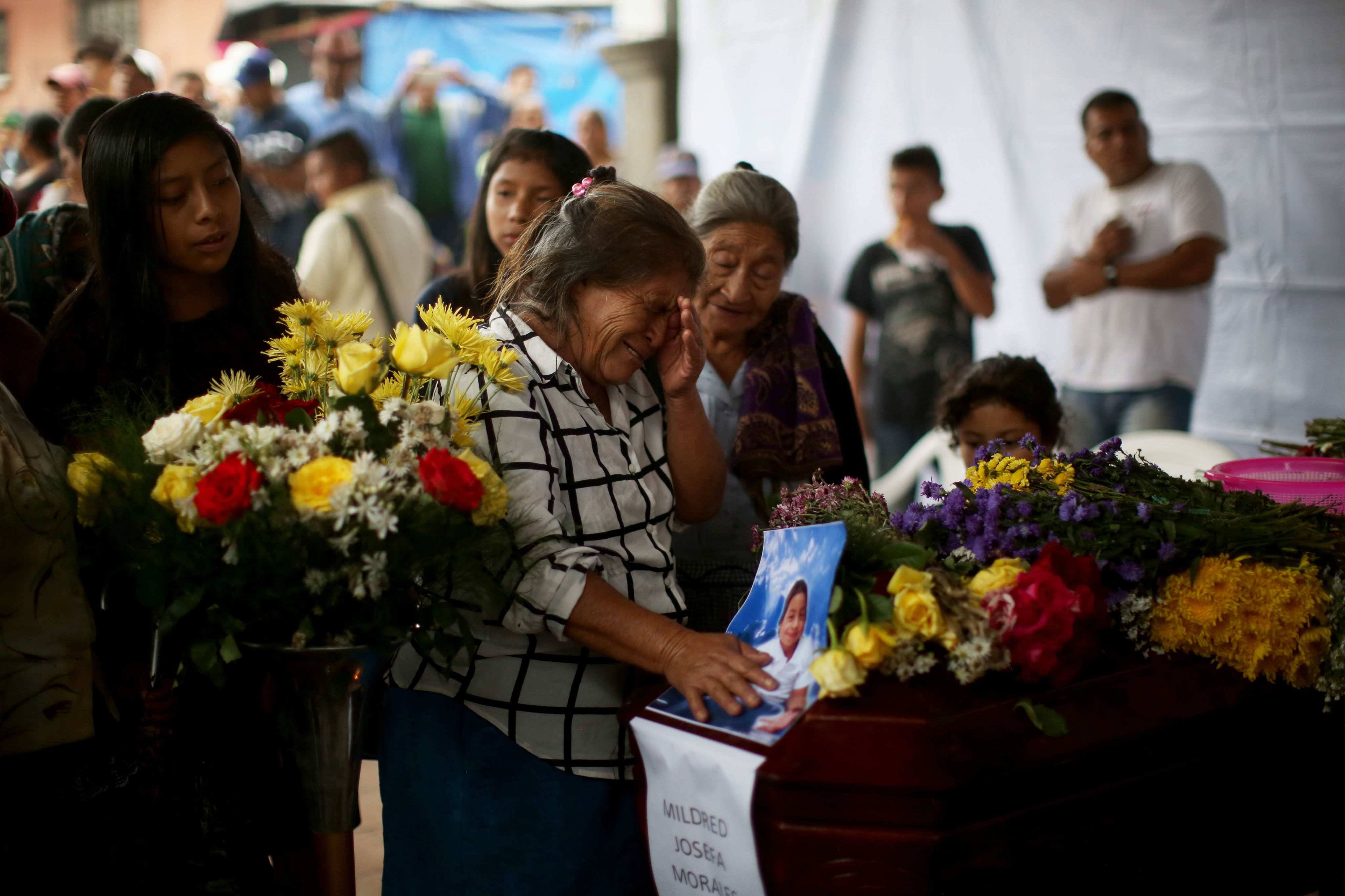 Mourning and grief reign in Guatemala after deadly volcanic eruption: A woman weeps on June 4, 2018, over the coffin of her young daughter, who died in the eruption of Guatemala's Volcan del Fuego volcano. EFE