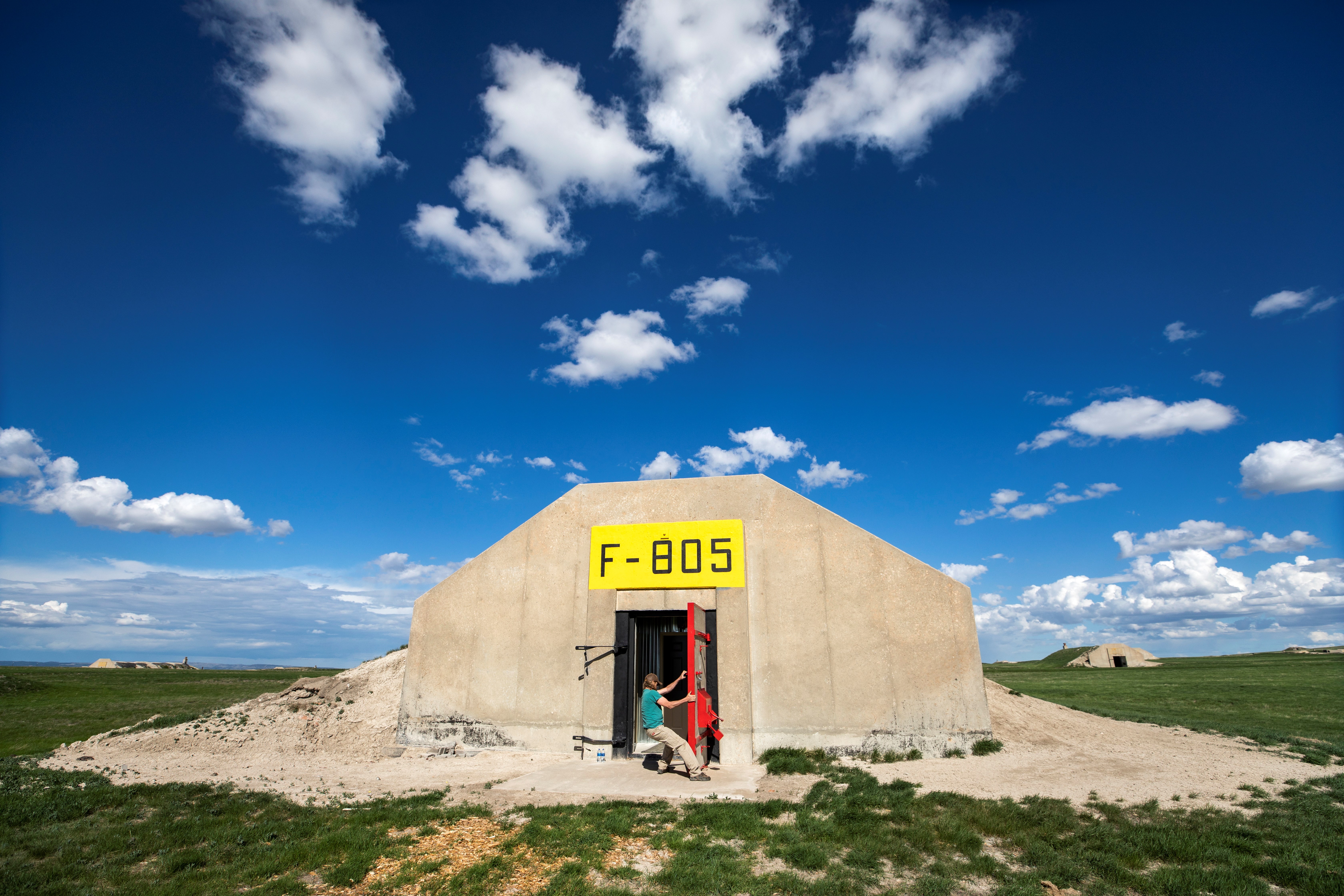 Lyle Goodman closes the door on a former U.S. Army munitions bunkers, which a developer is re-purposing into a doomsday community for civilians called Vivos xPoint, near Edgemont, South Dakota, USA, May 8, 2018. EPA-EFE/JIM LO SCALZO
