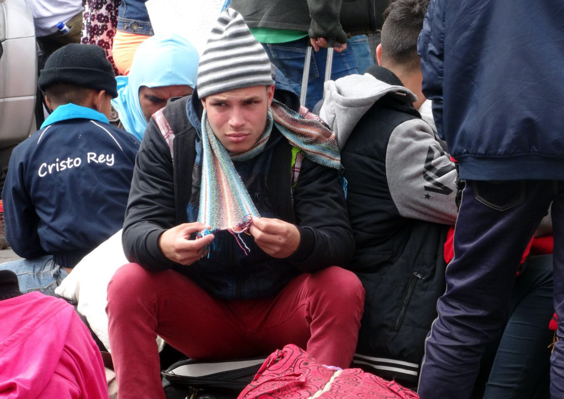 Venezuelans wait to enter Ecuador at the Rumichaca international bridge in Tulcan, Ecuador, on Aug. 19, 2018. EFE-EPA/Maria Paula Goyes
