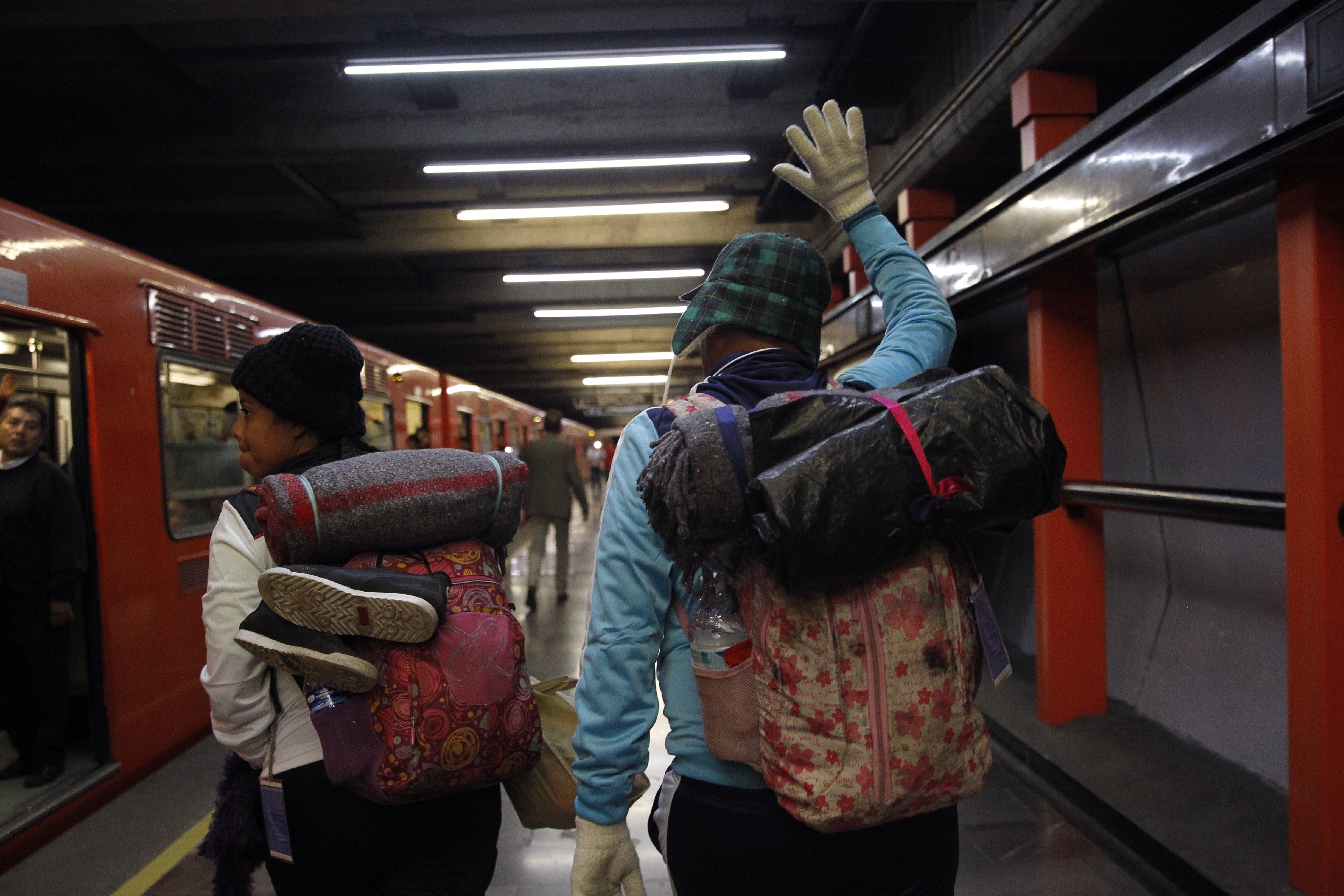 Members of the caravan of Central American migrants prepare to depart Mexico City, Mexico, on their way to the United States, Nov. 9, 2018. EPA-EFE/Sashenka Gutierrez
