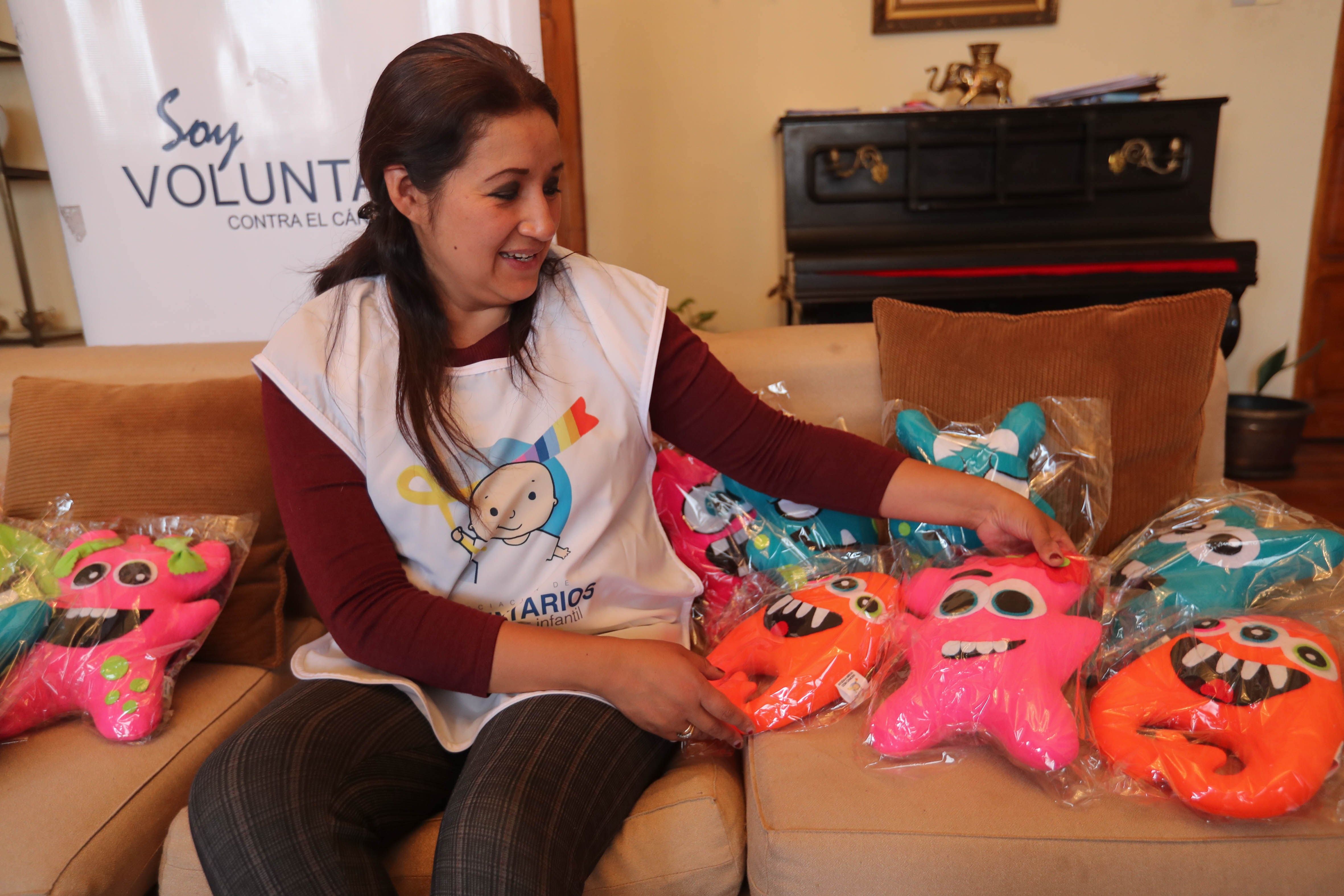 Ana Carola Torres, president of Bolivia's Association of Volunteers against Childhood Cancer (AVCCI), is seen on Nov. 15, 2018 presenting at an interview with EFE the kind of dolls used in the association's "Conquering Monsters" project to aid childhood cancer patients and their families. EFE-EPA/Martin Alipaz