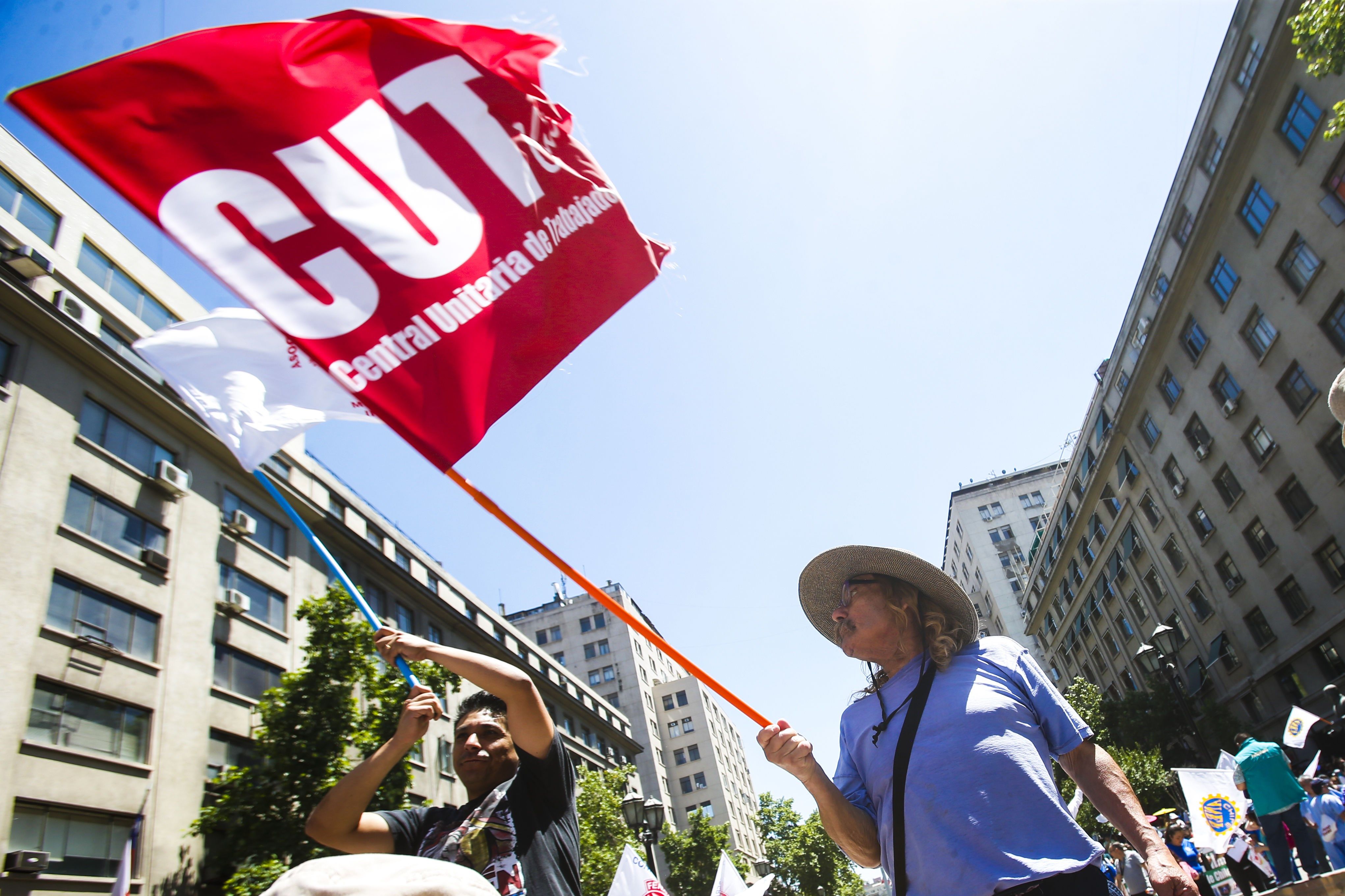 Officials of the Chilean public sector protest in front of La Moneda Palace, in Santiago, Chile, 26 November 2018. The National Association of Tax Employees (Anef), which includes 350,000 officials, estimated a 90% following of the national strike called today to demand an adjustment in the annual salary increase and to protest the 'wave of dismissals'. EPA/EFE/Alberto Pena
