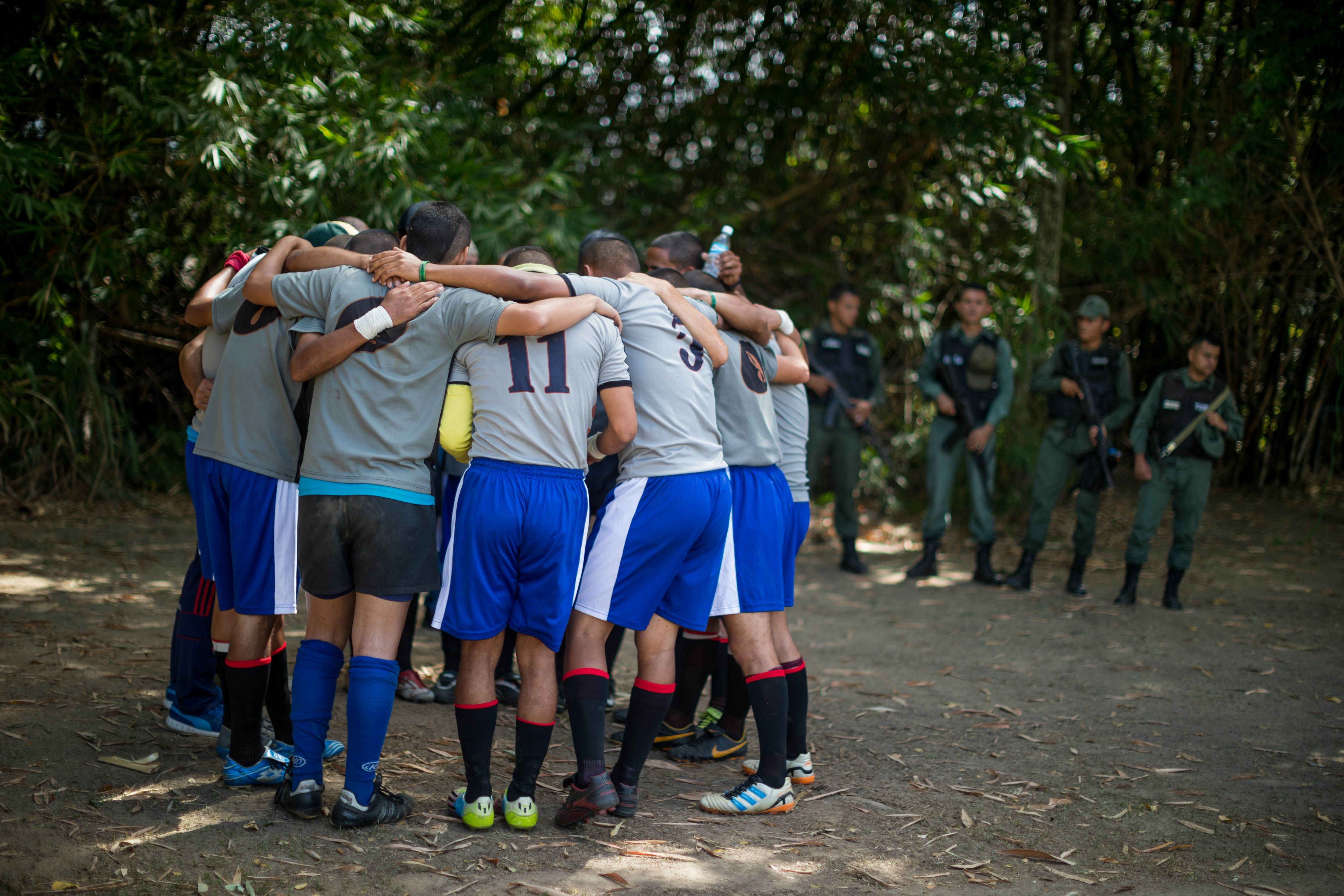 Photo of inmates in Venezuela allowed out their cells on Dec. 1, 2018, to play rugby in a tourney organized by the Santa Teresa rum distillery, giving them a rare opportunity to run around in the fresh air, see their families and just be athletes. EFE-EPA/Miguel Gutierrez