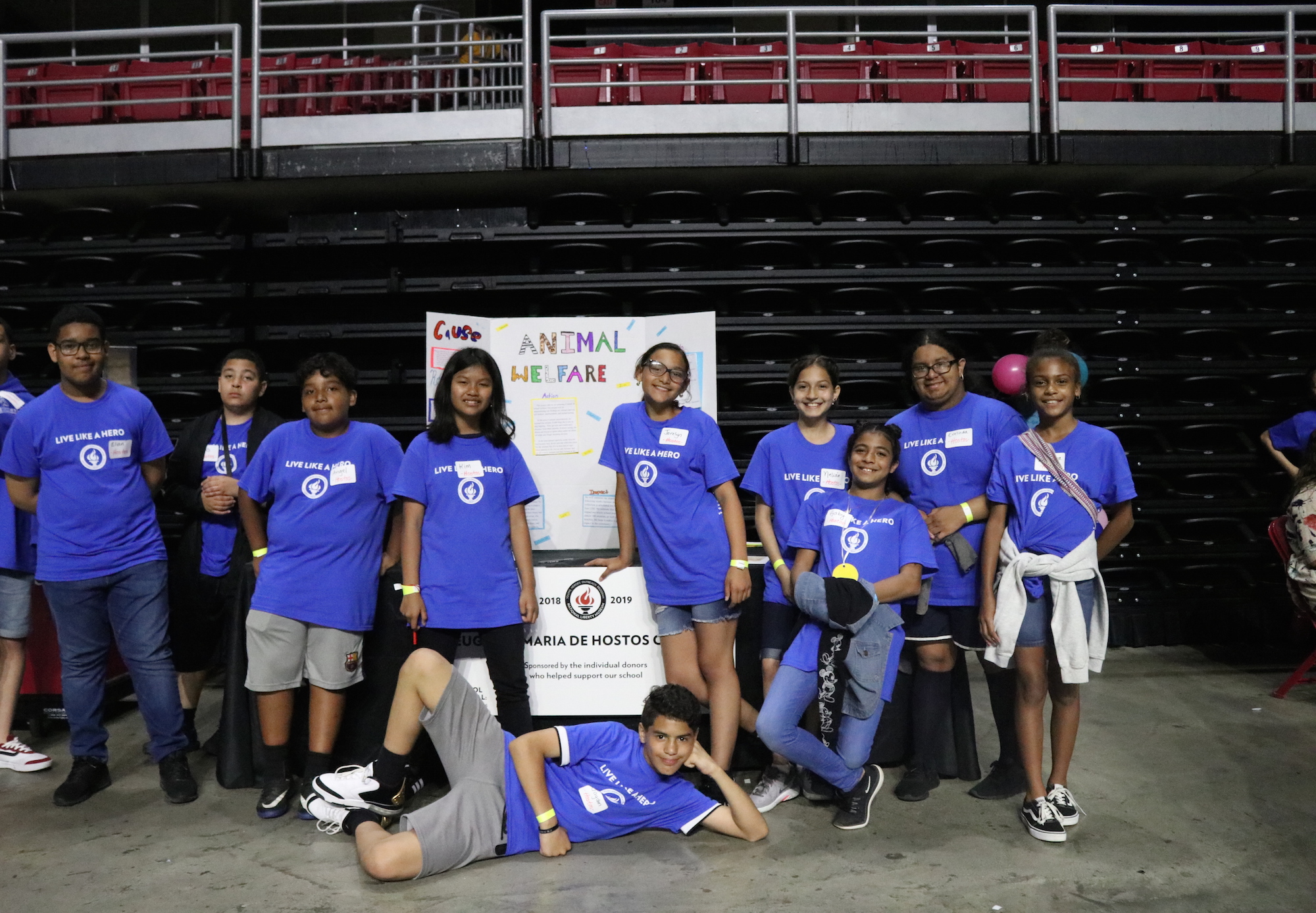 Sixth grade students from Eugenio Maria de Hostos Charter School pose in front of their project display in the Liacouras Center on May 30. Photo: Nigel Thompson/AL DÍA News.