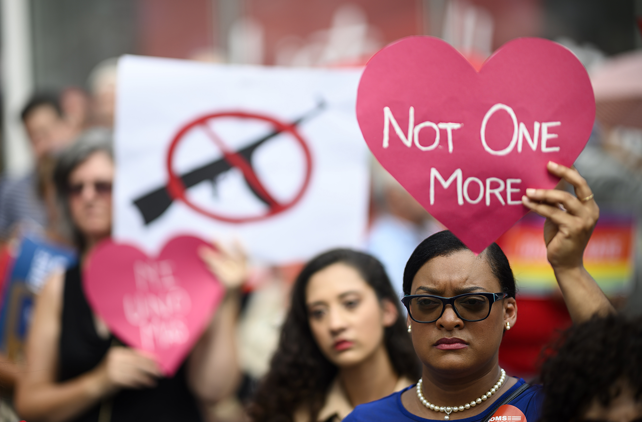 Protester holding up an anti-gun violence sign that reads "Not One More."Photo: Johannes Eisele/Getty Images