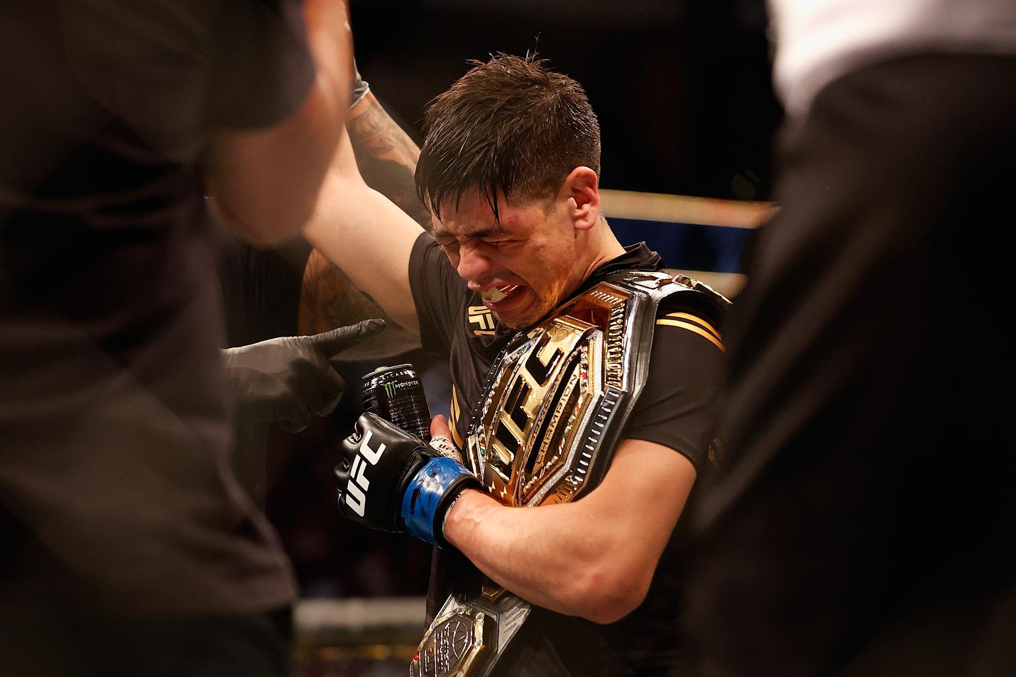 Brandon Moreno of Mexico celebrates after defeating Deiveson Figueiredo of Brazil to win the flyweight championship during their UFC 263 match at Gila River Arena on June 12, 2021 in Glendale, Arizona. (Getty Images)