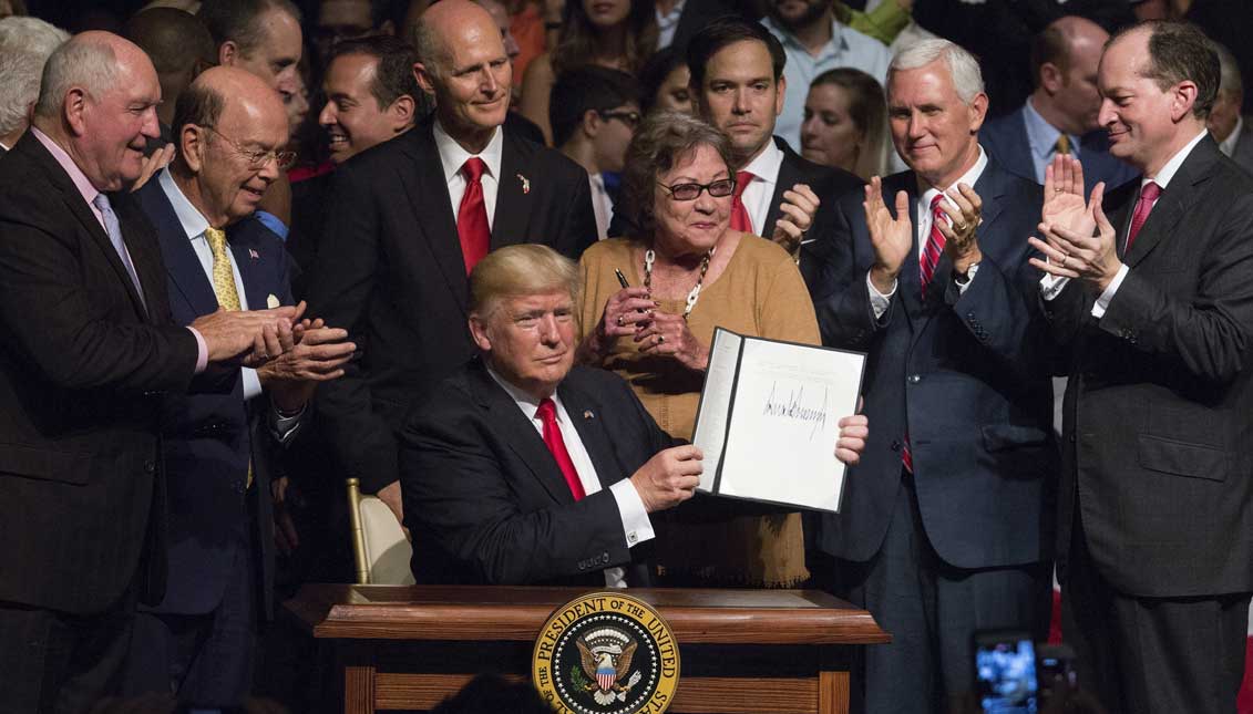 US President Donald J. Trump shows the National Security Presidential Memorandum on Cuba, he signed after giving remarks at Manuel Artime Theater in Miami, Florida, USA. EFE