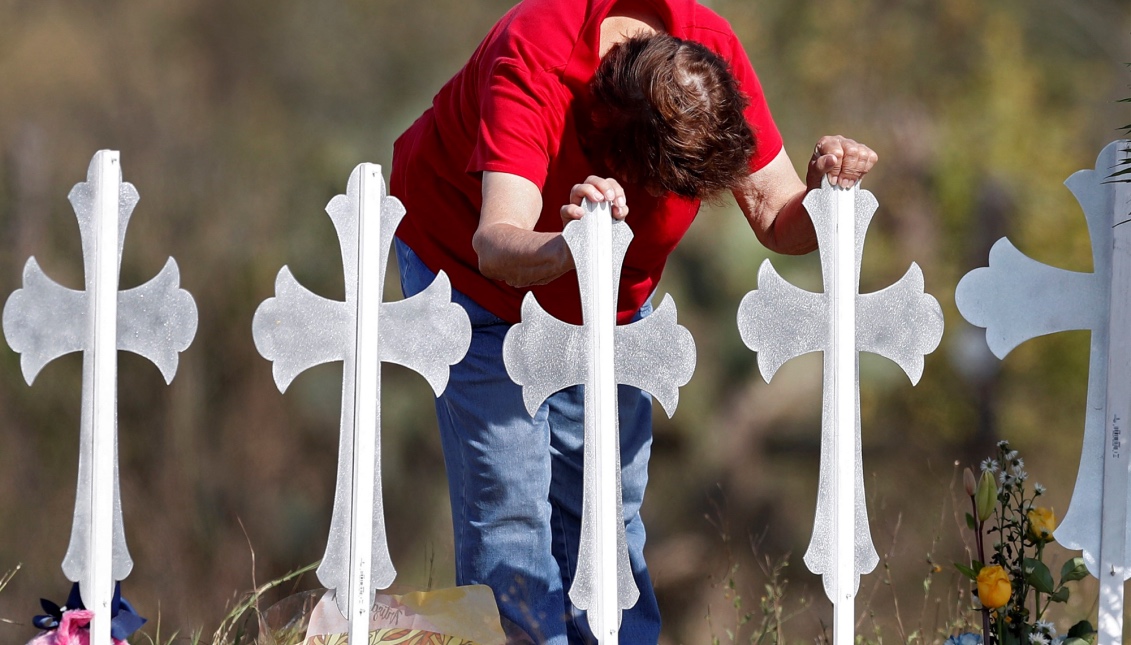 Maria Durand cries while visiting the 26 crosses installed in a field in Sutherland Springs, Texas, USA, on November 7, 2017, in honor of the 26 people who died in a shooting at a Baptist church.