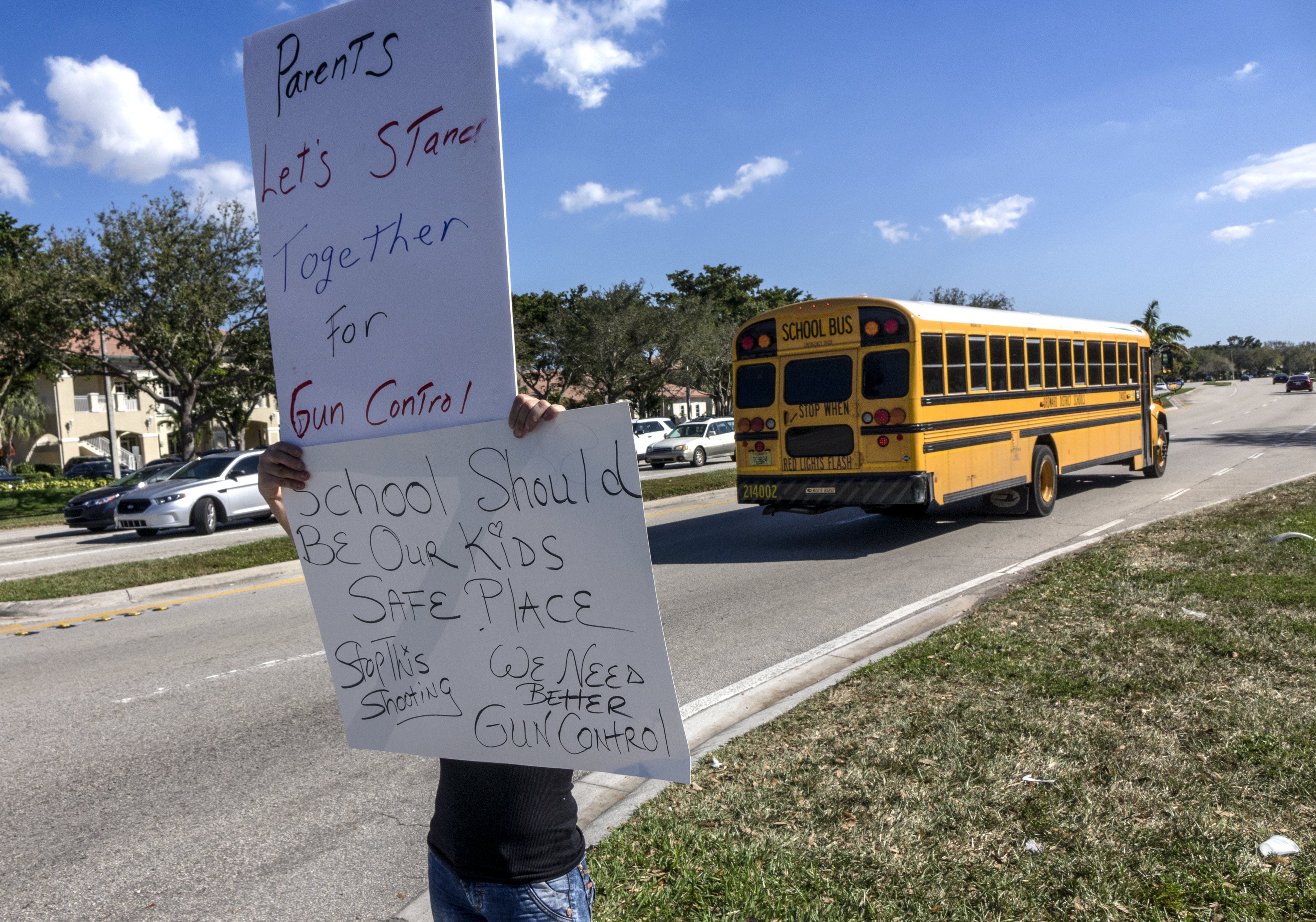 Rosa Alma waves signs ask demanding guns legislations, in Coral Springs, Florida, USA on 16 February 2018. Nikolas Jacob Cruz, reportedly an expelled student, has been charged with seventeen counts of premeditated murder in the shooting at Marjory Stoneman Douglas High School in Parkland, Florida on 14 February 2018. EFE