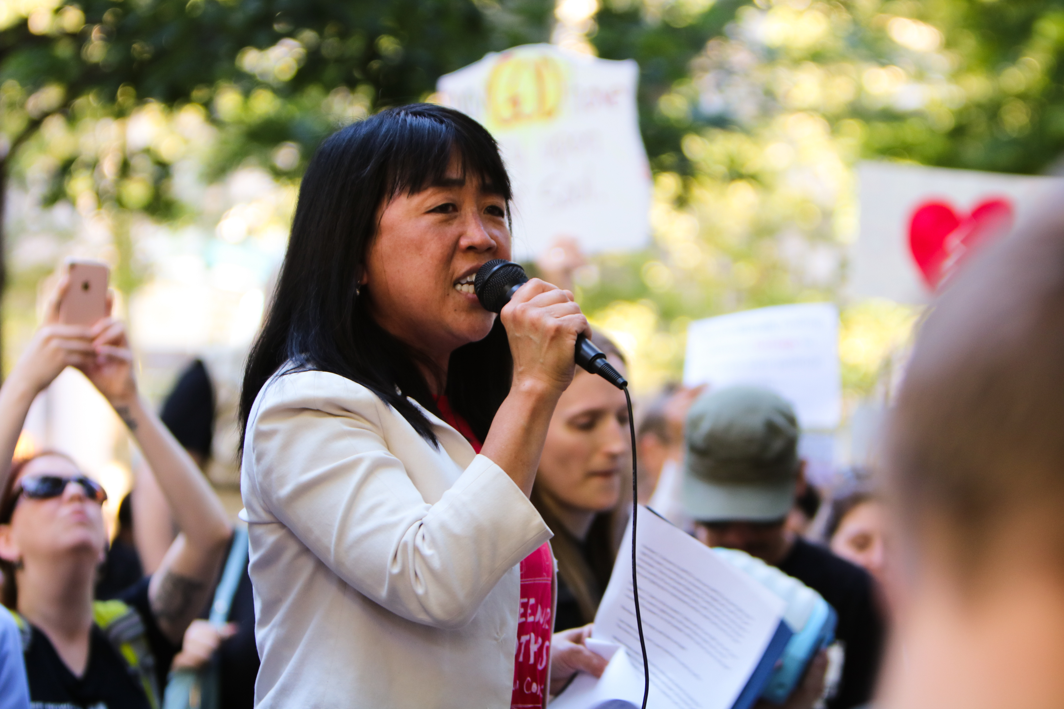 Philadelphia Councilwoman Helen Gym spoke at the June 19 rally in Rittenhouse Square against the Trump administration's immigration policies. Greta Anderson / AL DÍA News
