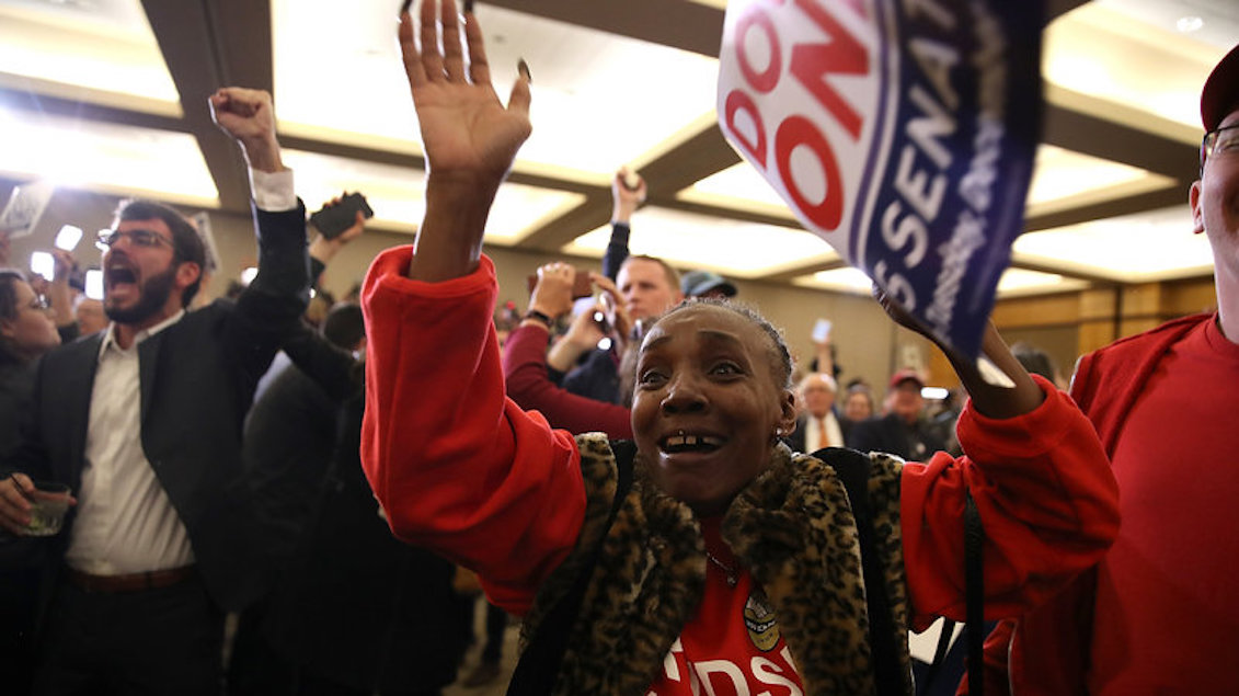 Supporters of Democrat Doug Jones celebrate as Jones is projected to be the winner in Alabama's special Senate election during his election night gathering Tuesday in Birmingham, Ala. Justin Sullivan/Getty Images