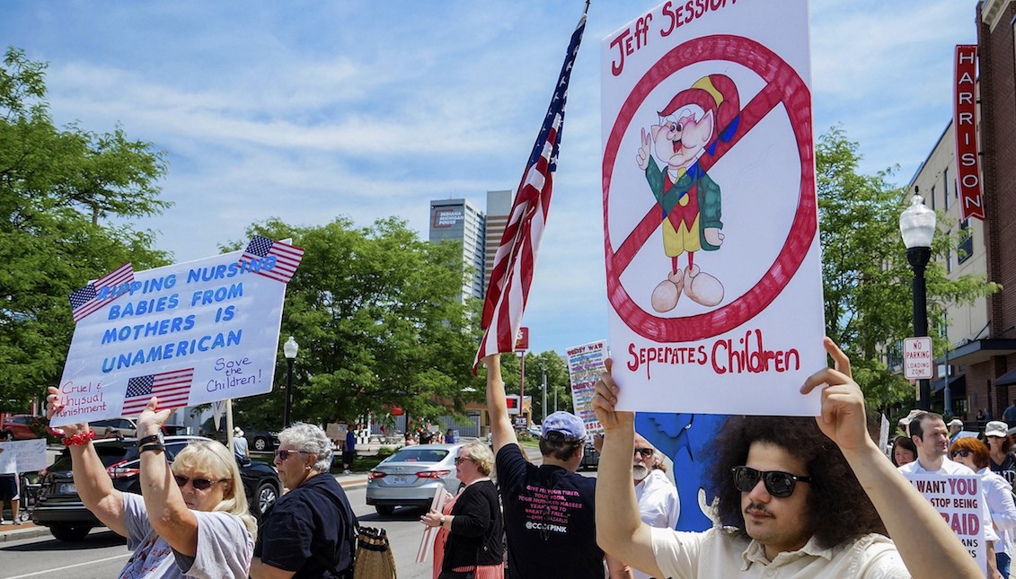 Demonstrators line up to protest U.S. Attorney General Jeff Sessions and immigration reform at Parkview Field in Fort Wayne, Ind. Thursday, June 14, 2018. (Mike Moore/The Journal-Gazette via AP)