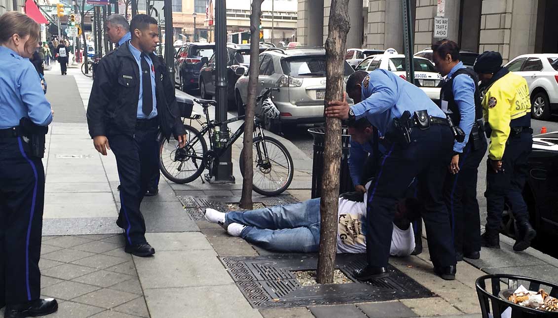 Police are given a lot of latitude in enforcement, like capturing this man who bolted from the Criminal Justice Center in Center City. However, the law does not allow police to violate Police Department policies and constitutional rights. LBW Photo.
