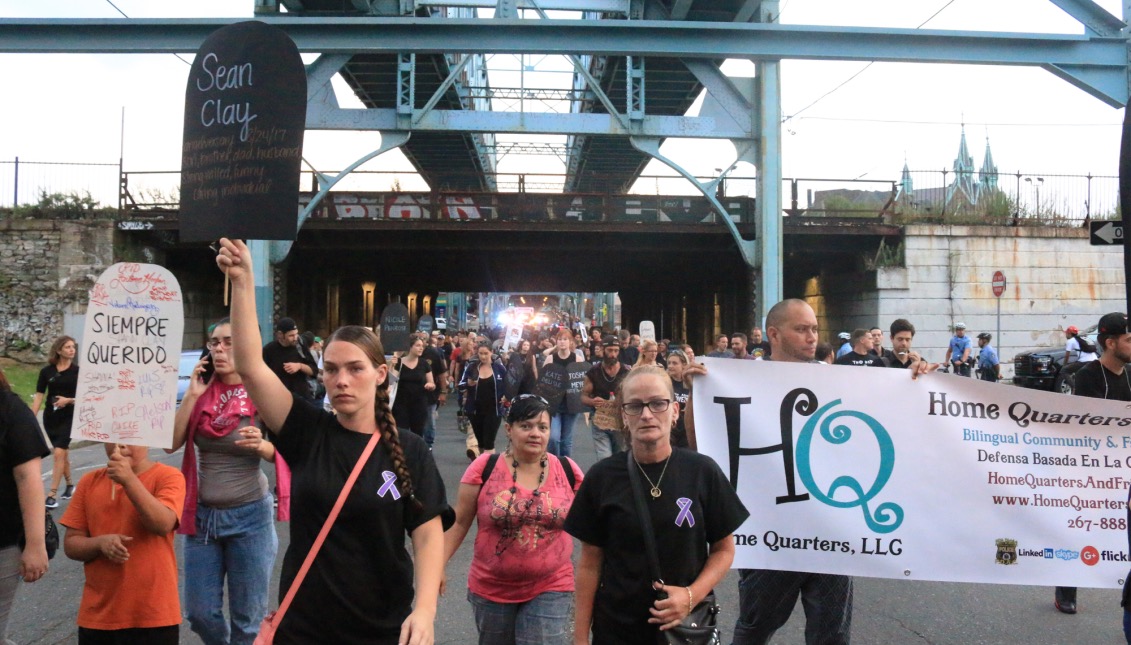 Participants in the march emerge from underneath the bridge at Lehigh and Kensington avenues. The march took individual's past Tusculum street, which is known for high volumes of drug activity in the area. Photos: Matthew Haubenstein