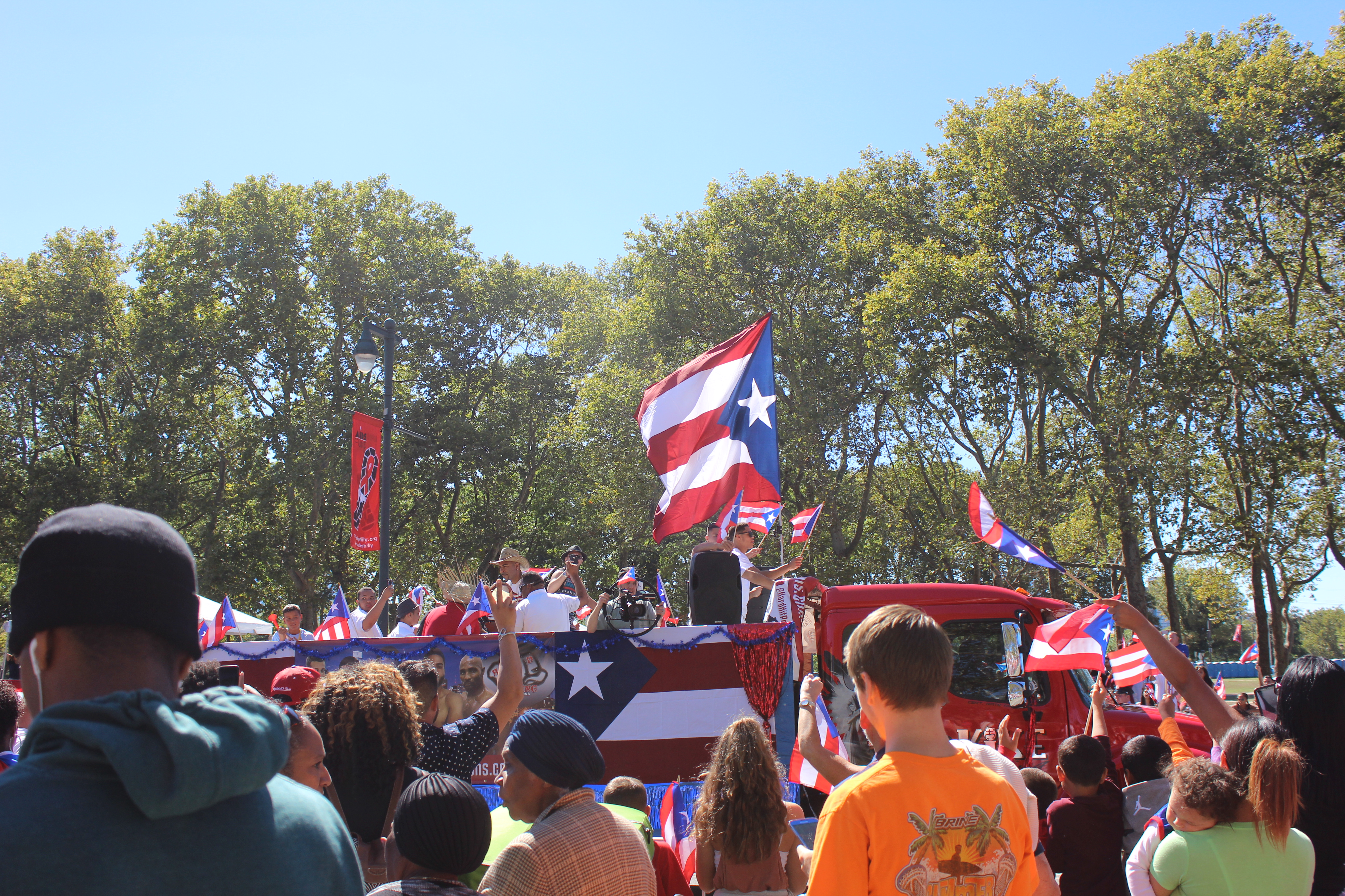 Crowd stands to watch parade
