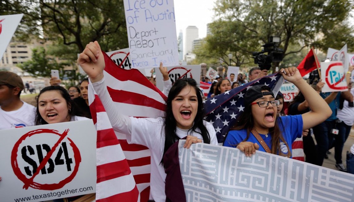 Protesters in Austin, Texas, take part in a rally to support the rights of immigrants, oppose a border wall, and support sanctuary cities, February 28, 2017. AP/Eric Gay. Source: https://www.americanprogress.org