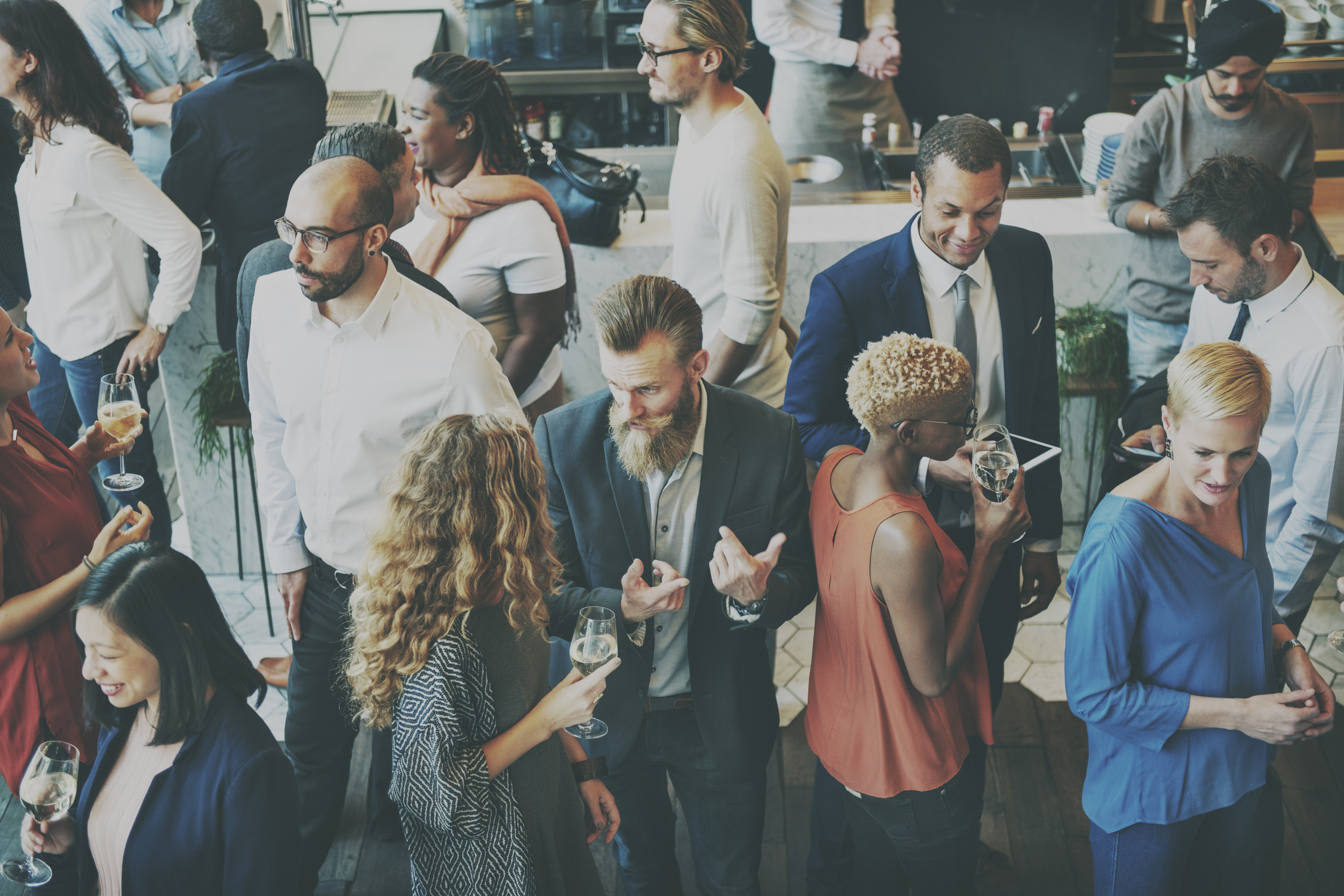 A diverse group of business professionals gather at a meet and greet. Photo courtesy: ThinkStock 