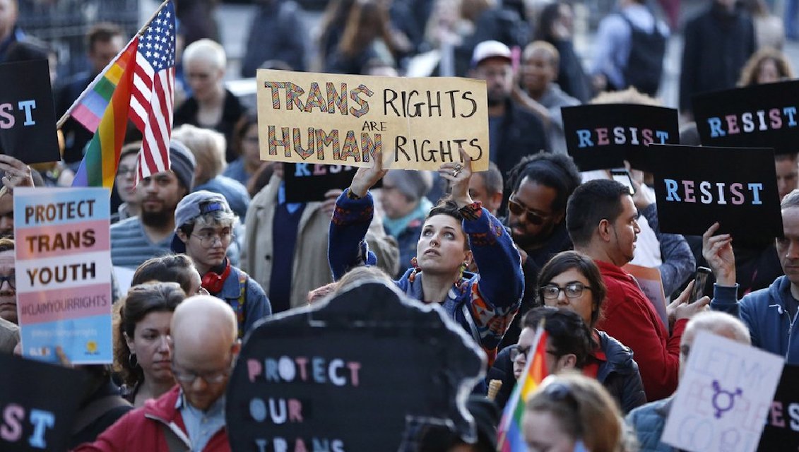 Several people protest against President Trump's decision to reinstate the ban against transgender people in the Armed Forces. Source: http://thewisdomdaily.com/