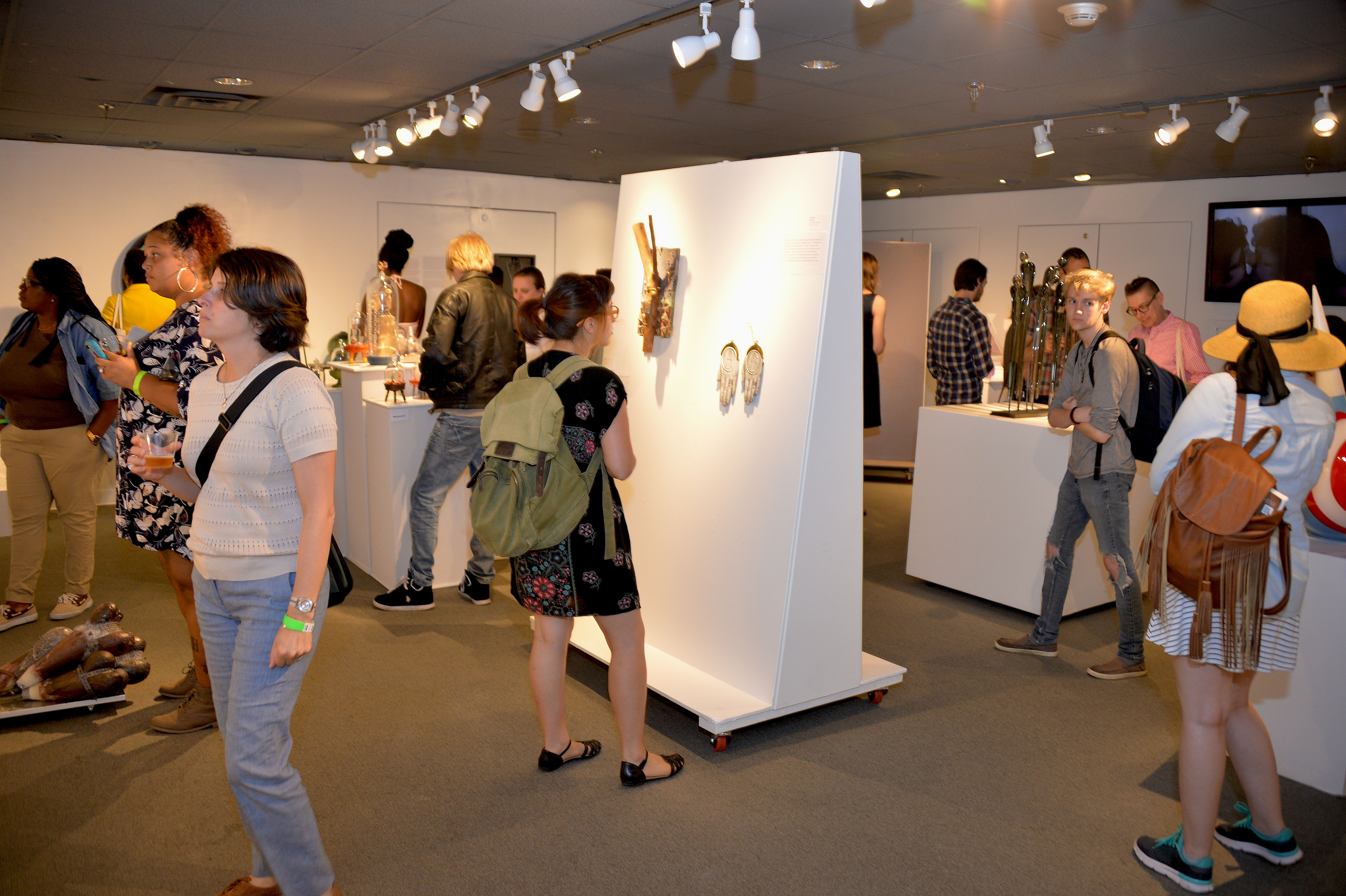 Guests celebrate the opening of the studio glass exhibition "Transparency: An LGBTQ+ Glass Art Exhibition" at the National Liberty Museum this past weekend.  Photo: Peter Fitzpatrick/AL DIA News