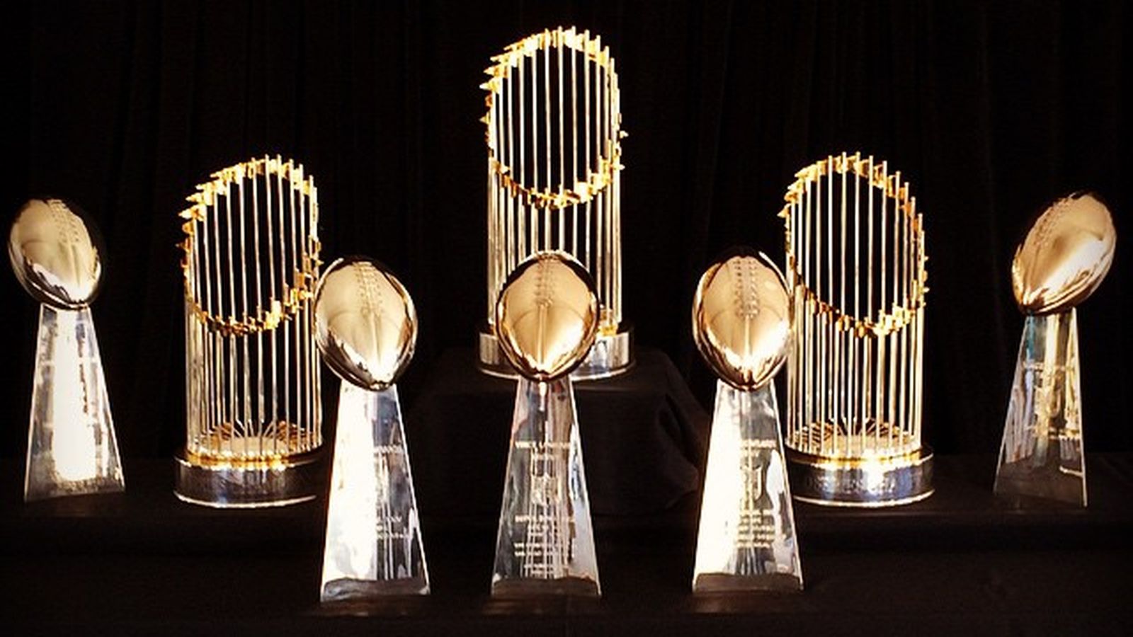 Several Superbowl and World Series trophies