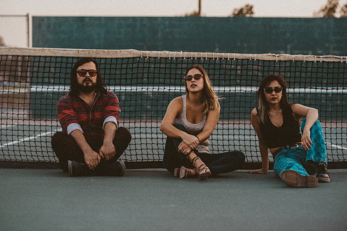 Estereomance pose for a photo by the tennis court. Photo: Andrea Rojo
