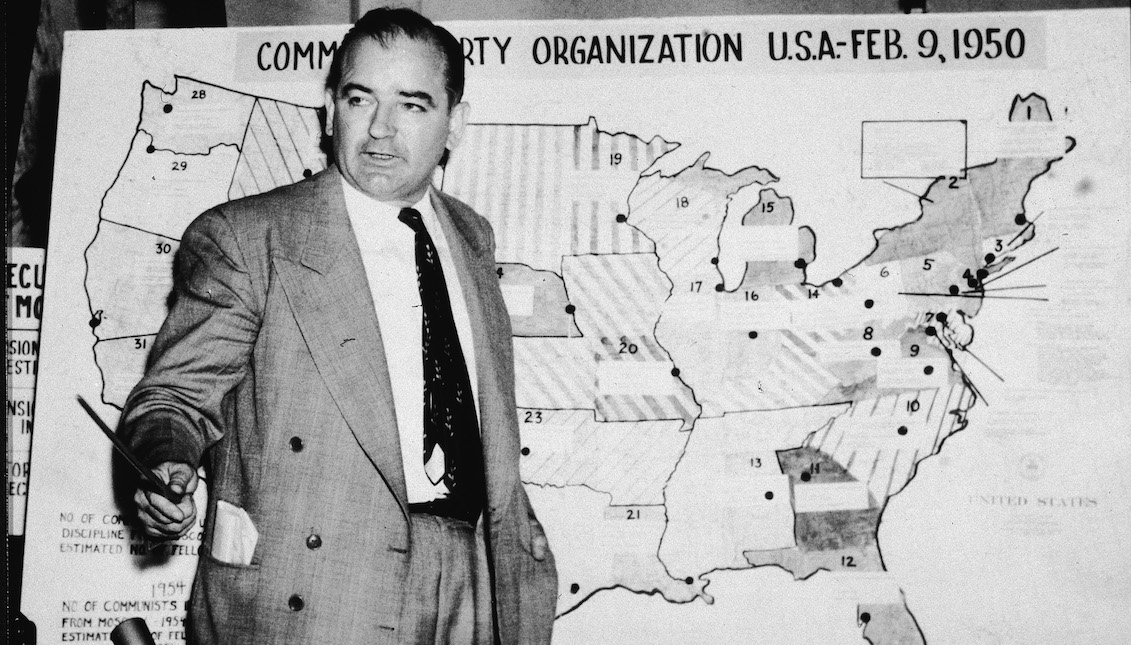 American politician Joseph McCarthy (1908 ? 1957), Republican senator from Wisconsin, testifies against the US Army during the Army-McCarthy hearings, Washington, DC, June 9, 1954. McCarthy stands before a map which charts Communist activity in the United States. (Photo by Getty Images)