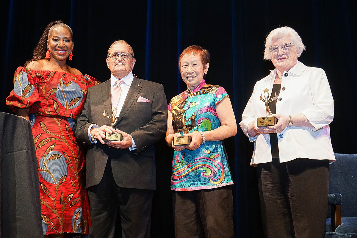 Chioma Ugochukwu, Provost of Cabrini University, presents Ray Yabor, Margaret Chin and Anne O' Sullivan with the 2019 Mother Cabrini Immigrant Heritage Award.  Photos: Peter Fitzpatrick/ALDIA News