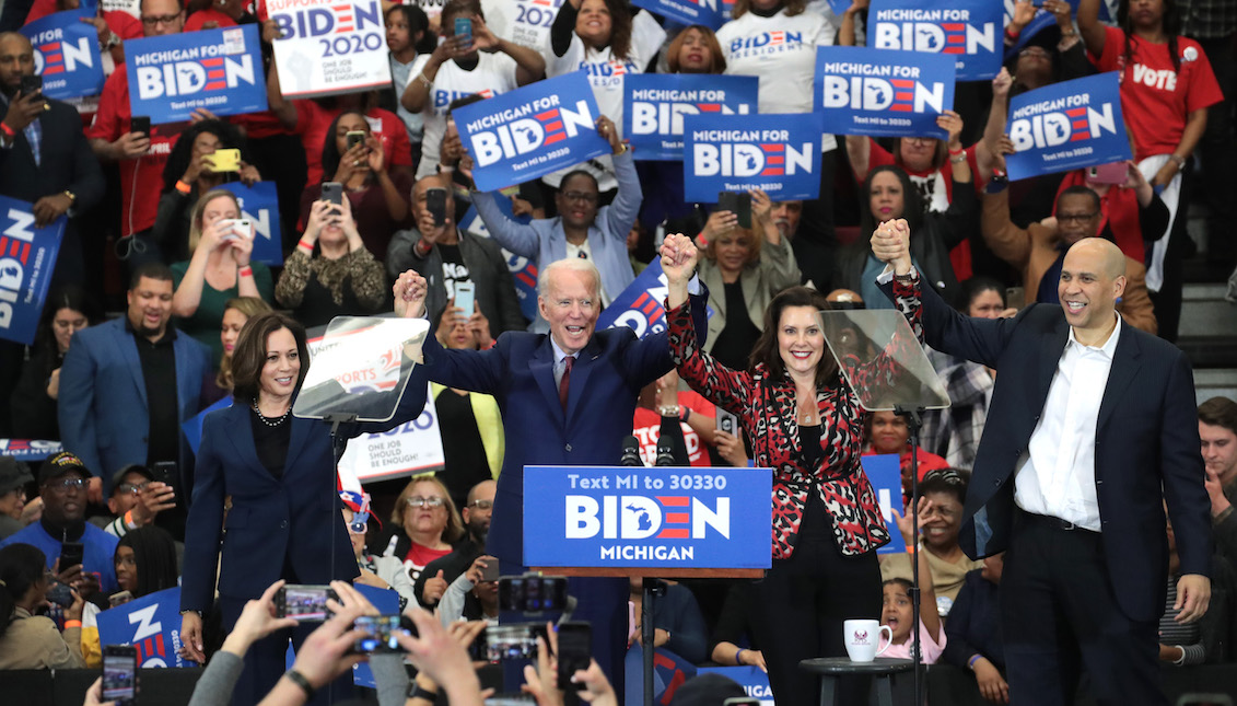 DETROIT, MICHIGAN - MARCH 09: Sen. Kamala Harris (L) (D-CA), Sen. Cory Booker (R)(D-NJ), and Michigan Governor Gretchen Whitmer join Democratic presidential candidate former Vice President Joe Biden on stage at a campaign rally at Renaissance High School on March 09, 2020 in Detroit, Michigan. Michigan will hold its primary election tomorrow. (Photo by Scott Olson/Getty Images)