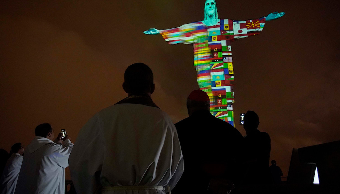 Rio de Janeiro's Christ the Redeemer lit up from the 166 flags of countries affected by coronavirus. Source: Intriper