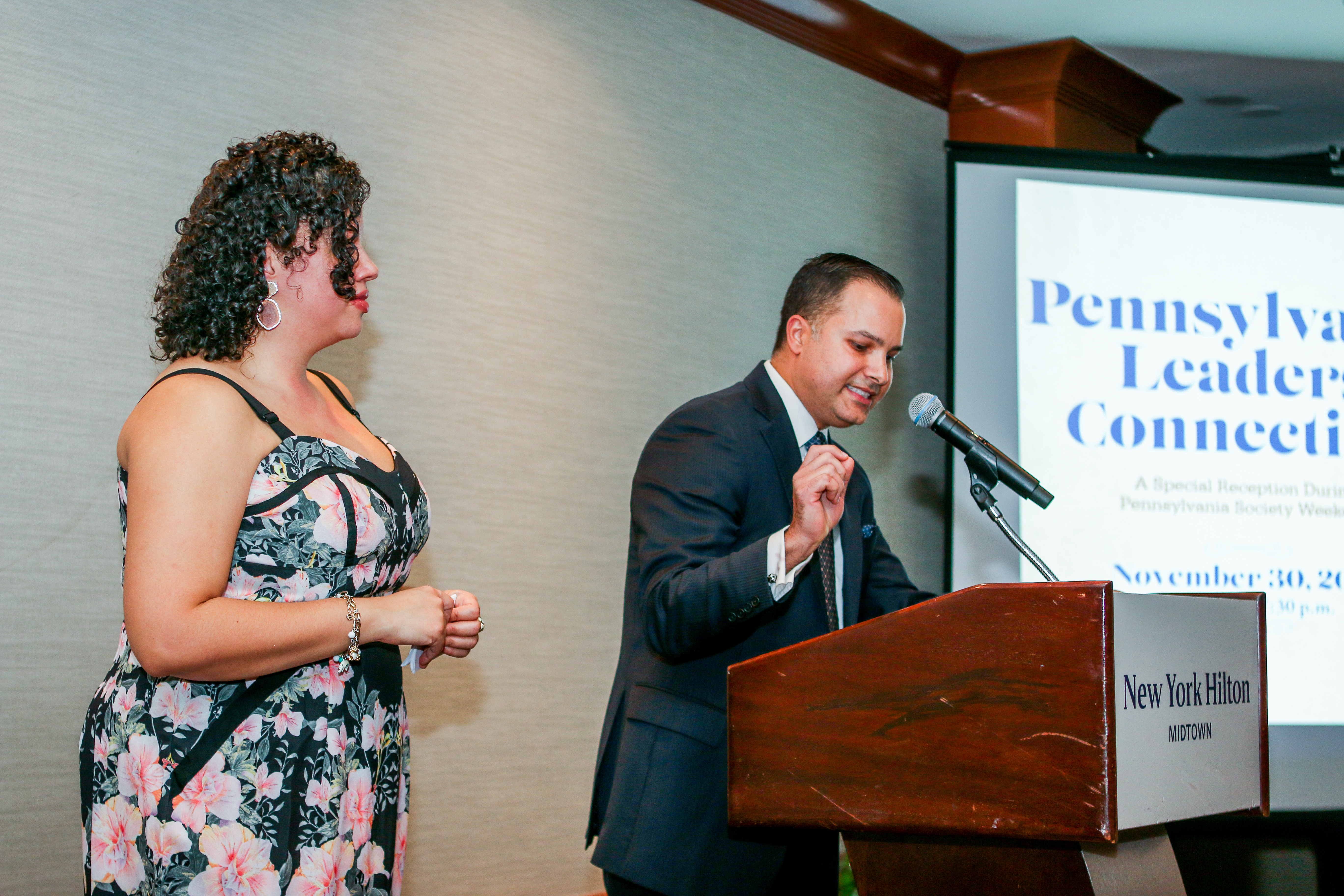 Anthony Rosado (right) addresses attendees as Tiffany Tavarez (left) looks on. Photo: Desiree Halpern.