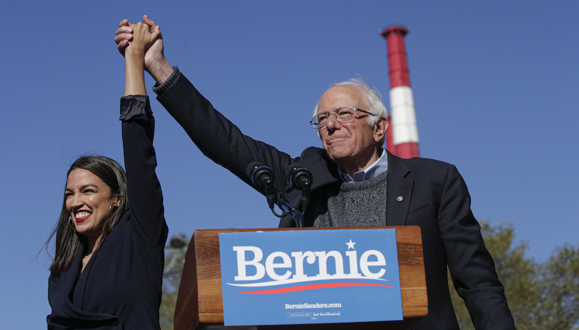 NEW YORK, NY - OCTOBER 19: Rep. Alexandria Ocasio-Cortez (D-NY) endorses Democratic presidential candidate, Sen. Bernie Sanders (I-VT) at a campaign rally in Queensbridge Park on October 19, 2019 in the Queens borough of New York City. This is Sanders' first rally since he paused his campaign for the nomination due to health problems. (Photo by Kena Betancur/Getty Images)