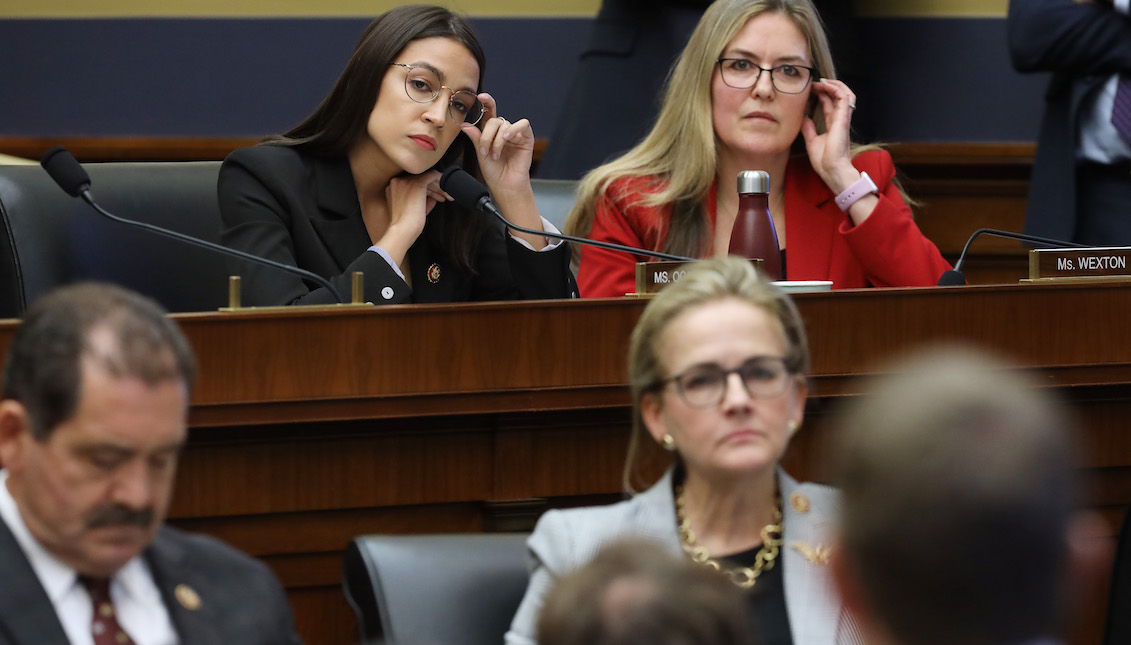 WASHINGTON, DC - OCTOBER 23: House Financial Services Committee member Rep. Alexandria Ocasio-Cortez (D-NY) questions Facebook co-founder and CEO Mark Zuckerberg with Rep. Jennifer Wexton (D-VA) during a hearing in the Rayburn House Office Building on Capitol Hill October 23, 2019, in Washington, DC. (Photo by Chip Somodevilla/Getty Images)