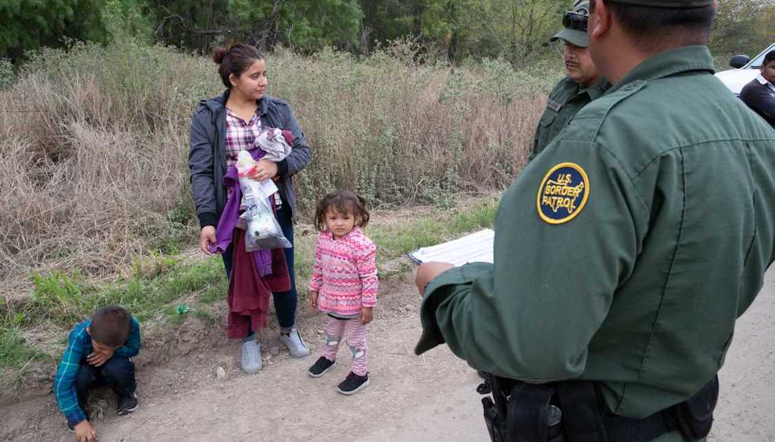 Border Patrol Agents take in to custody a 22-year-old women from El Salvador and her 5 and 3-year-old children after crossing the river from Mexico near Mission, Texas, on Tuesday, Feb. 26, 2019. Courtney Sacco/Caller-Times