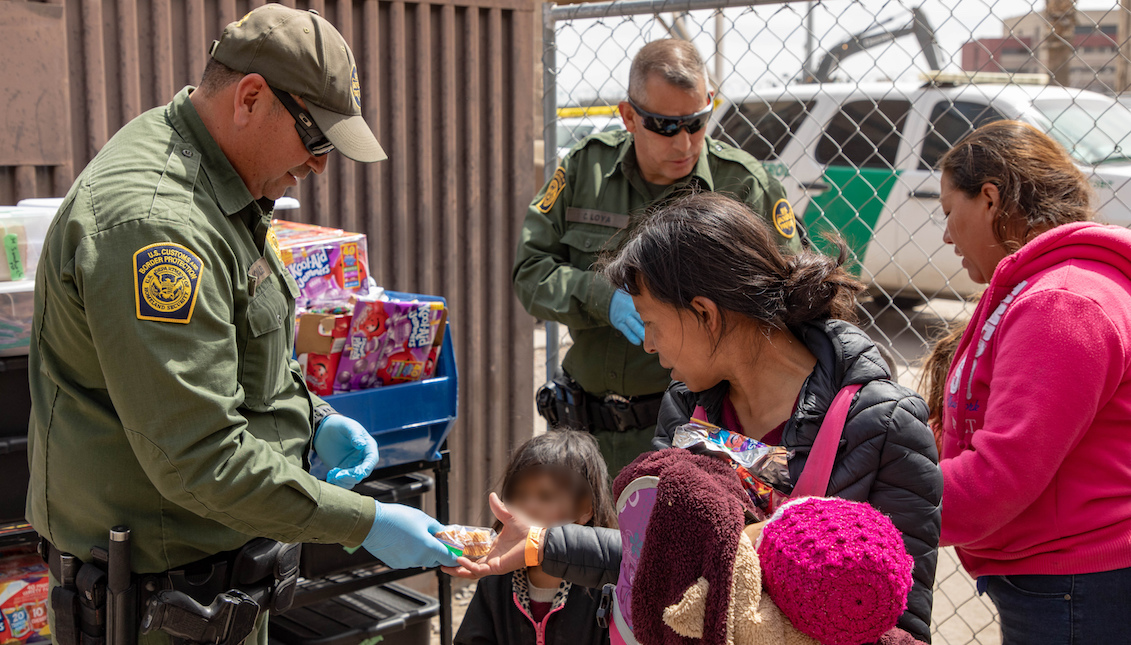 EL PASO, TX - MARCH 22: Image provided by the Office of Customs and Border Protection of Public Affairs of the United States, showing some immigrants after crossing the international border between the United States and Mexico, and surrendering to a border patrol agent. The migrants are taken to a processing center where they receive food and water, as well as medical attention if necessary, on March 22, 2019 in El Paso, Texas. (Photo by Mani Albrecht / Getty Images)