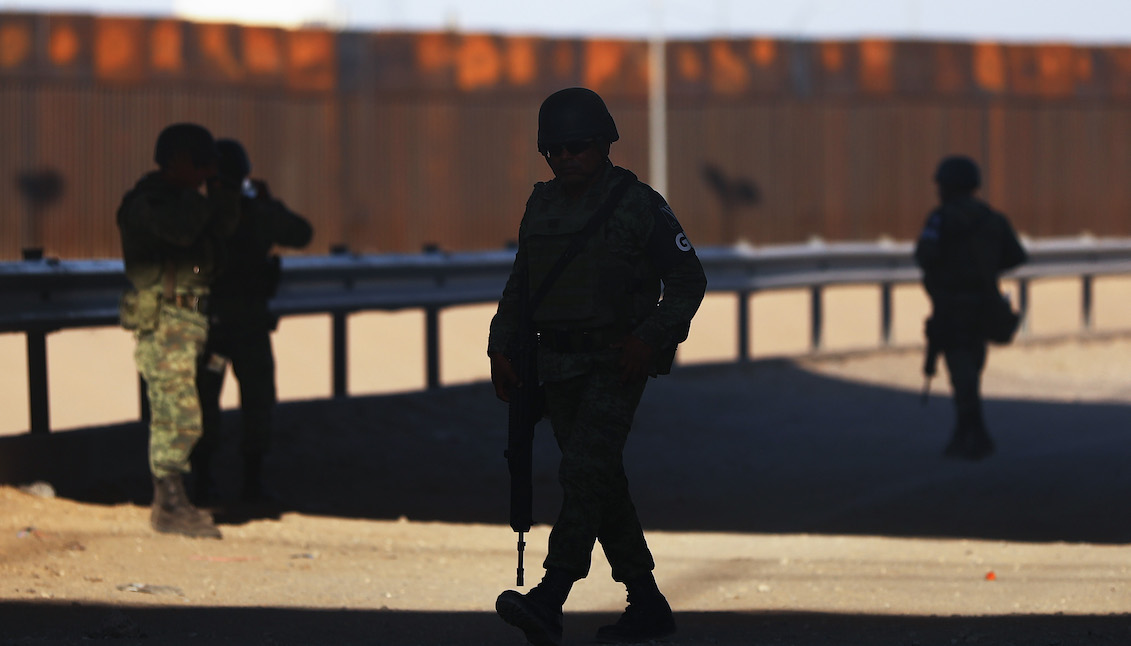 CIUDAD JUAREZ, MEXICO - JUNE 27: Mexican soldiers keep watch on the Mexican side of the U.S.-Mexico border on June 27, 2019, in Ciudad Juarez, Mexico. (Photo by Mario Tama/Getty Images)