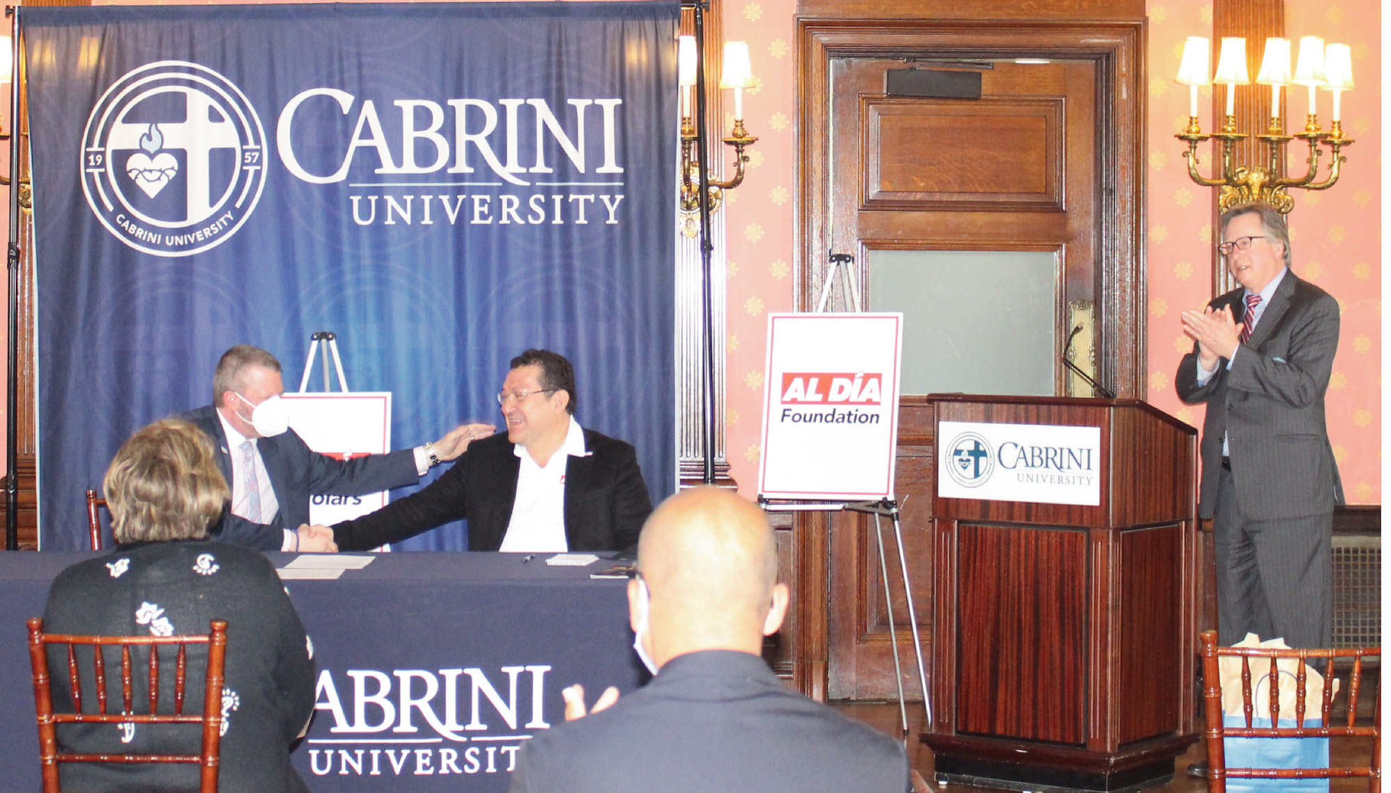 Cabrini University President Ph.D. Donald B. Taylor shakes hands with AL DIA CEO Hernán Guaracao. Photo: Oscar Lopez/AL DÍA News.