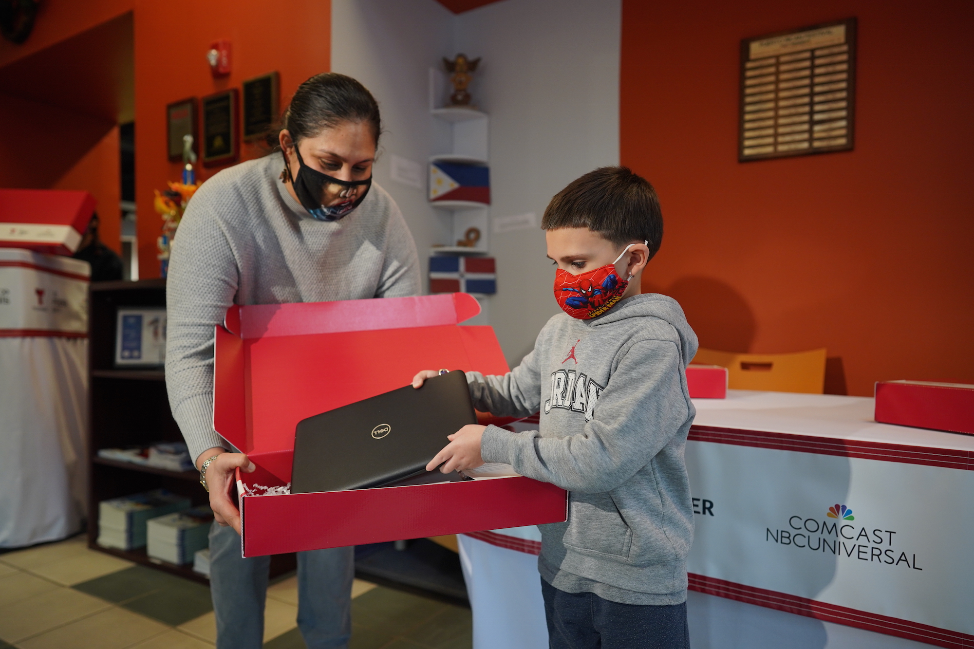 A student receives his laptop on Friday, Dec. 11. Photo: Telemundo 62
