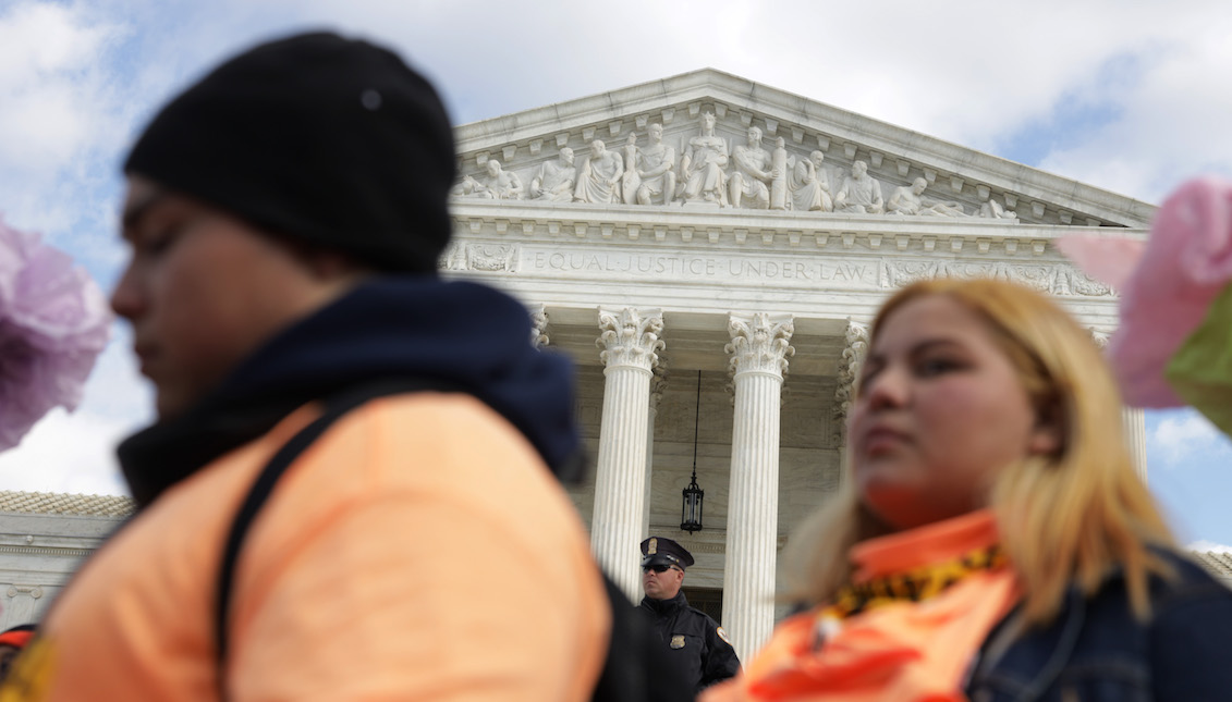 WASHINGTON, DC - NOVEMBER 08: A police officer stands guard as student immigration activists participate in a rally defending Deferred Action for Childhood Arrivals (DACA) in front of the U.S. Supreme Court after they walked out from area high schools and universities November 8, 2019, in Washington, DC. (Photo by Alex Wong/Getty Images)