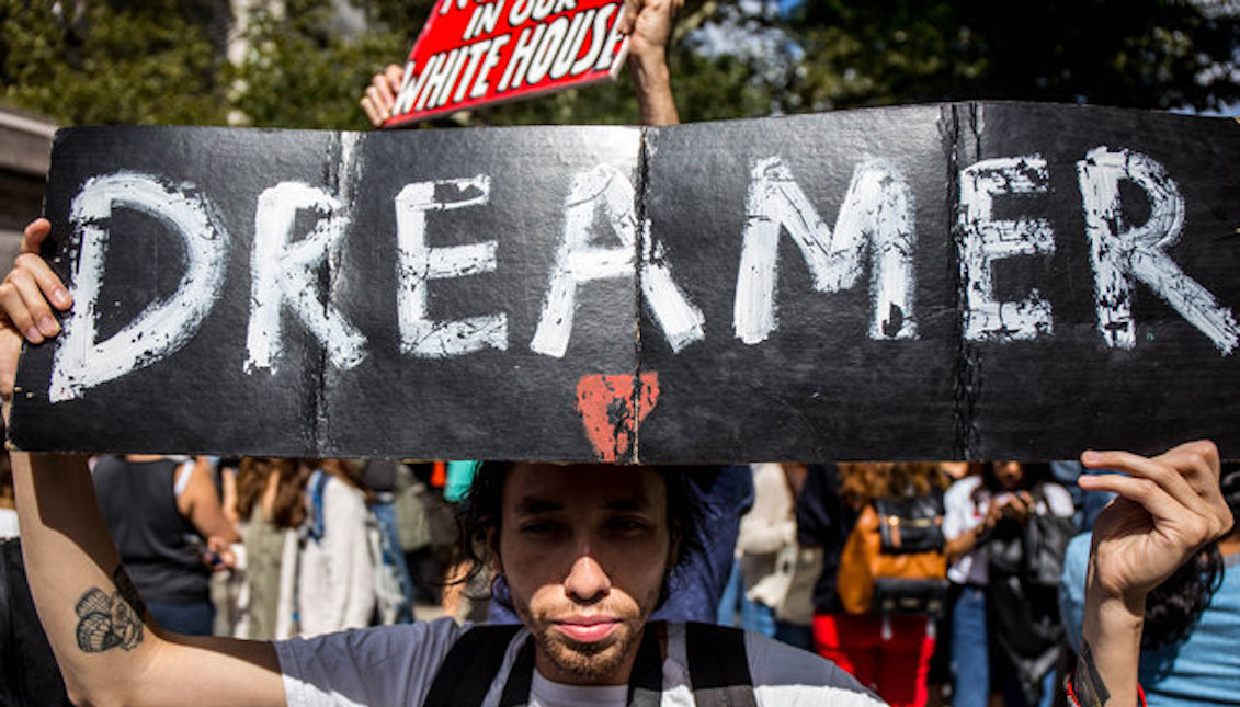 A young man marches for a definitive solution to undocumented immigrants arriving in the country as children. Source: http://fashthenation.com/