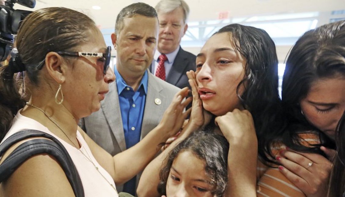 Alejandra Juarez, 39, (L) says goodbye to her children, Pamela and Estela at the Orlando International Airport on Friday, Aug. 3, 2018 in Orlando, Fla. Juarez, the wife of a former Marine is preparing to self-deport to Mexico in a move that would split up their family. (Red Huber/Orlando Sentinel via AP)