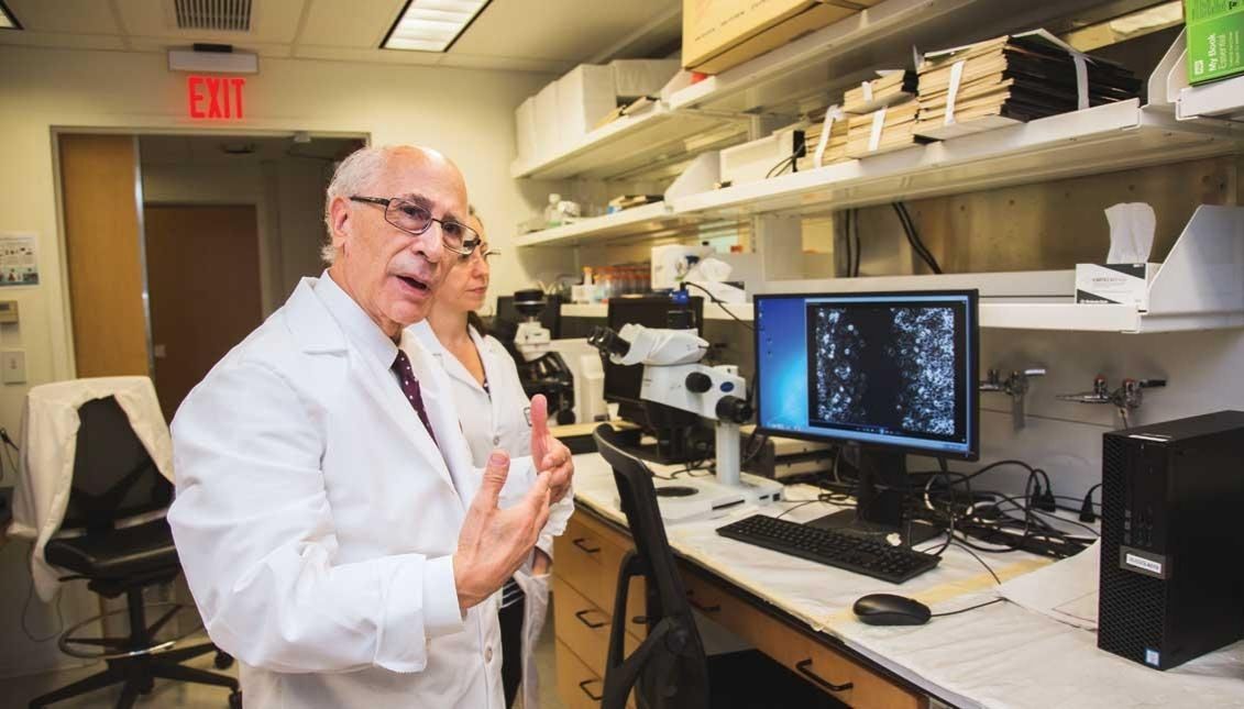 In his lab, Dr. Russo explains how fast cancer cells can develop, 2018. Photo: Sam Laub / AL DÍA News