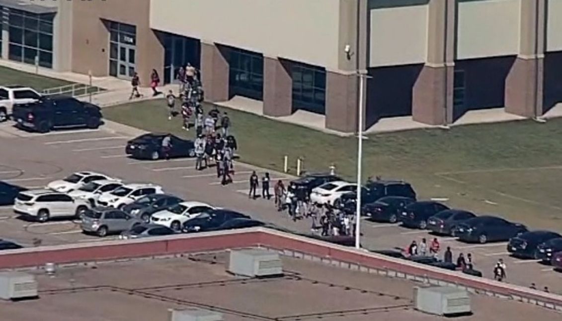 Images of students evacuating the high school. Photo: Security video capture