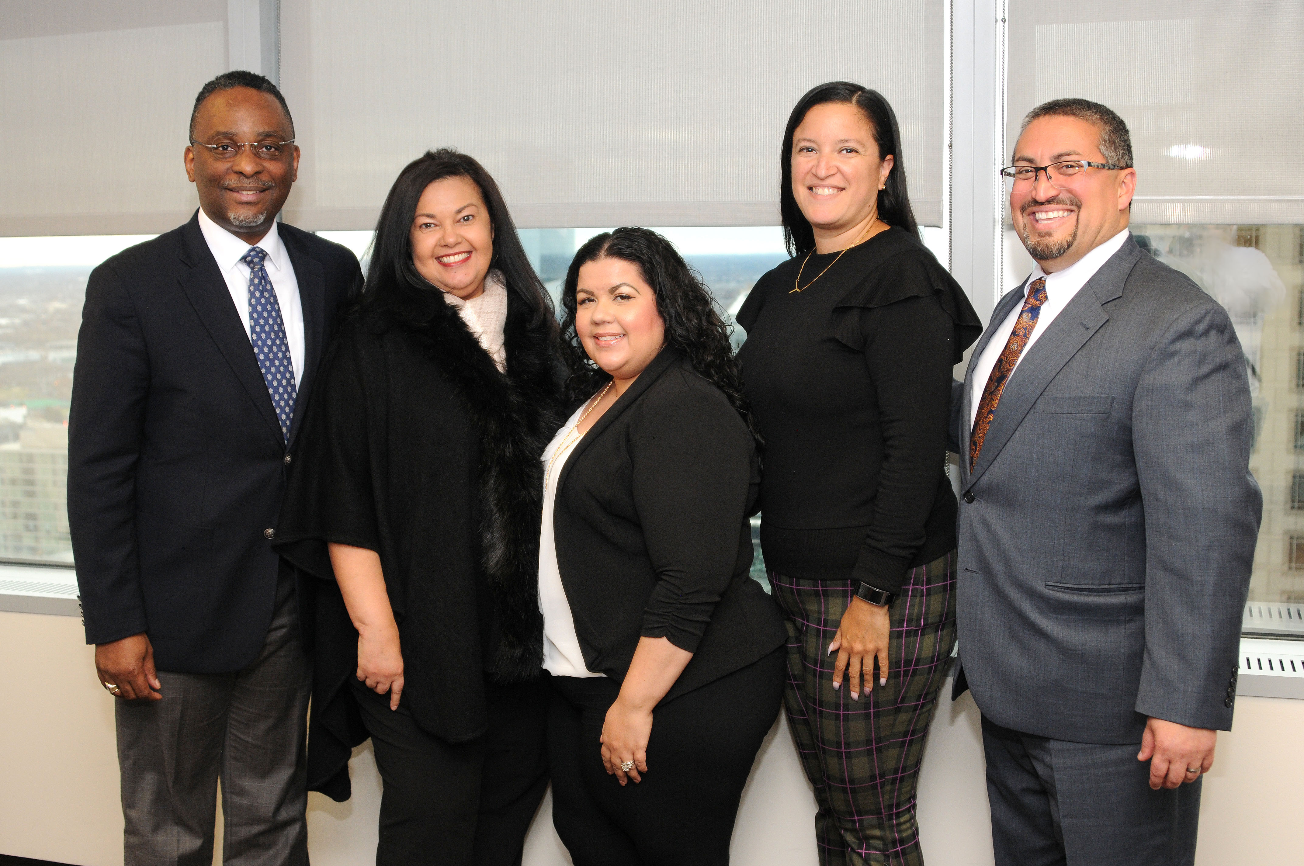 From Left to Right: John Clayton, (members of the Latinos Con Proposito resource group) Evelyn Vasquez-Gerczyk, Veronica Serrano-Herbin & Yasseline Diaz, and Juan Lopez. Photo: Peter Fitzpatrick / AL DIA News