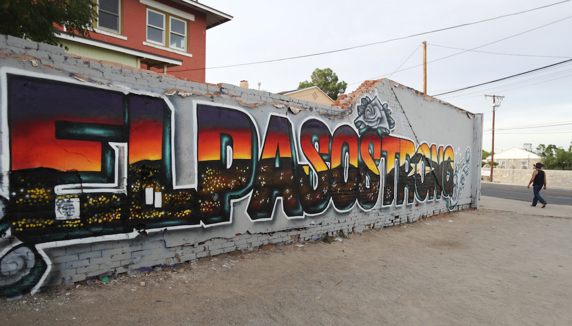 EL PASO, TEXAS - AUGUST 09: A man walks past the 'El Paso Strong' mural painted by artists Gabe Vasquez and Justin Martinez following the mass shooting at Walmart, which killed 22 people, on August 9, 2019 in El Paso, Texas. (Photo by Mario Tama/Getty Images)