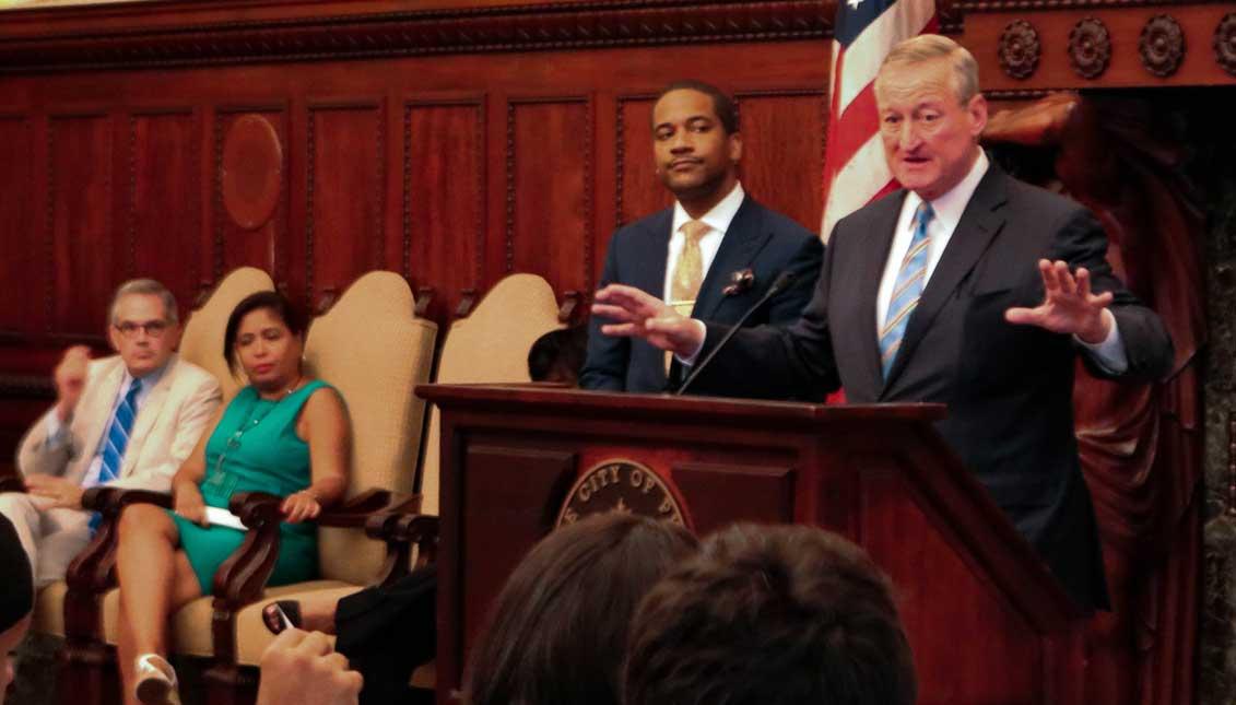 Mayor Jim Kenney addresses a crowd gathered at City Hall alongside City Solicitor Marcel Pratt in July. Greta Anderson / AL DÍA News