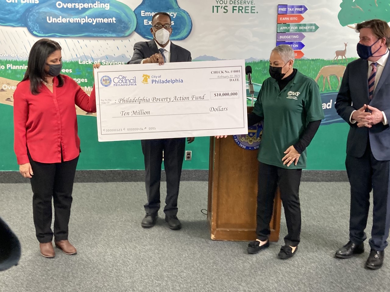 Councilmember María Quiñones-Sánchez, Council President Darrell Clarke, Mary Arthur of the Campaign for Working Families, and Bill Golderer of United Way of Greater Philadelphia and Southern New Jersey unveil the $10 million in funding for City Council's Poverty Action Plan. Photo: Twitter- @Darrell_Clarke