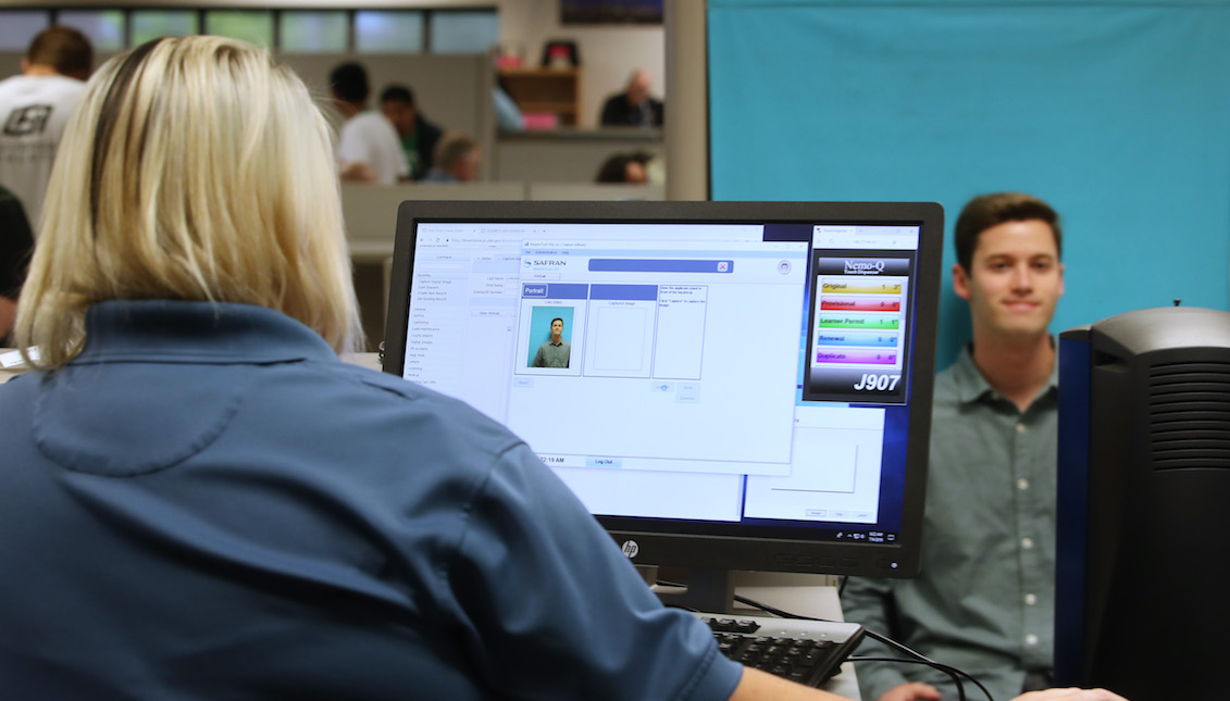 OREM, UT - JULY 09: A man has his photo taken at the Driver License Division for the state of Utah on July 9, 2019 in Orem, Utah. Documents recently made public show that the FBI and Immigration and Customs Enforcement (ICE) have made thousands of searches in Department of Motor Vehicle databases using facial recognition technology in at least three states including Utah, Vermont and Washington State. (Photo by George Frey/Getty Images)